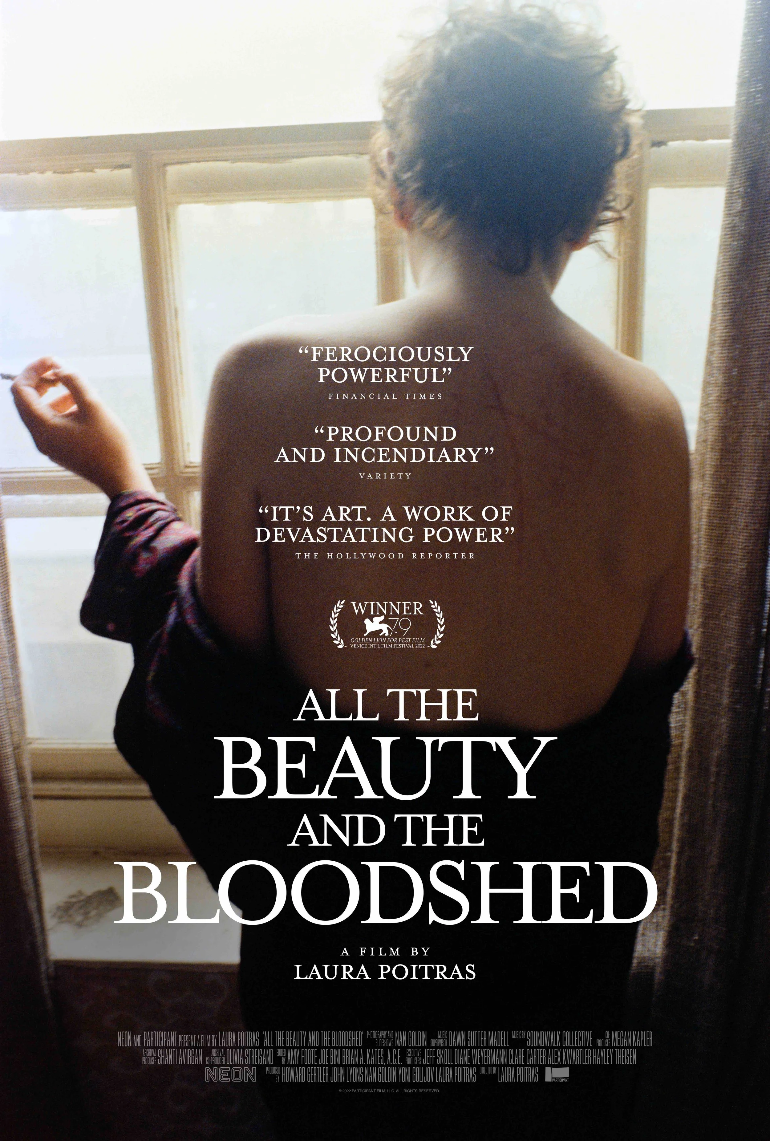 Film poster for 'All the Beauty and the Bloodshed' showing Nan Goldin in silhoutte, back turned, smoking a cigarette by a window.