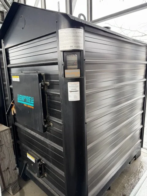 Large black commercial furnace with the brand name 'Empyre' on the side.