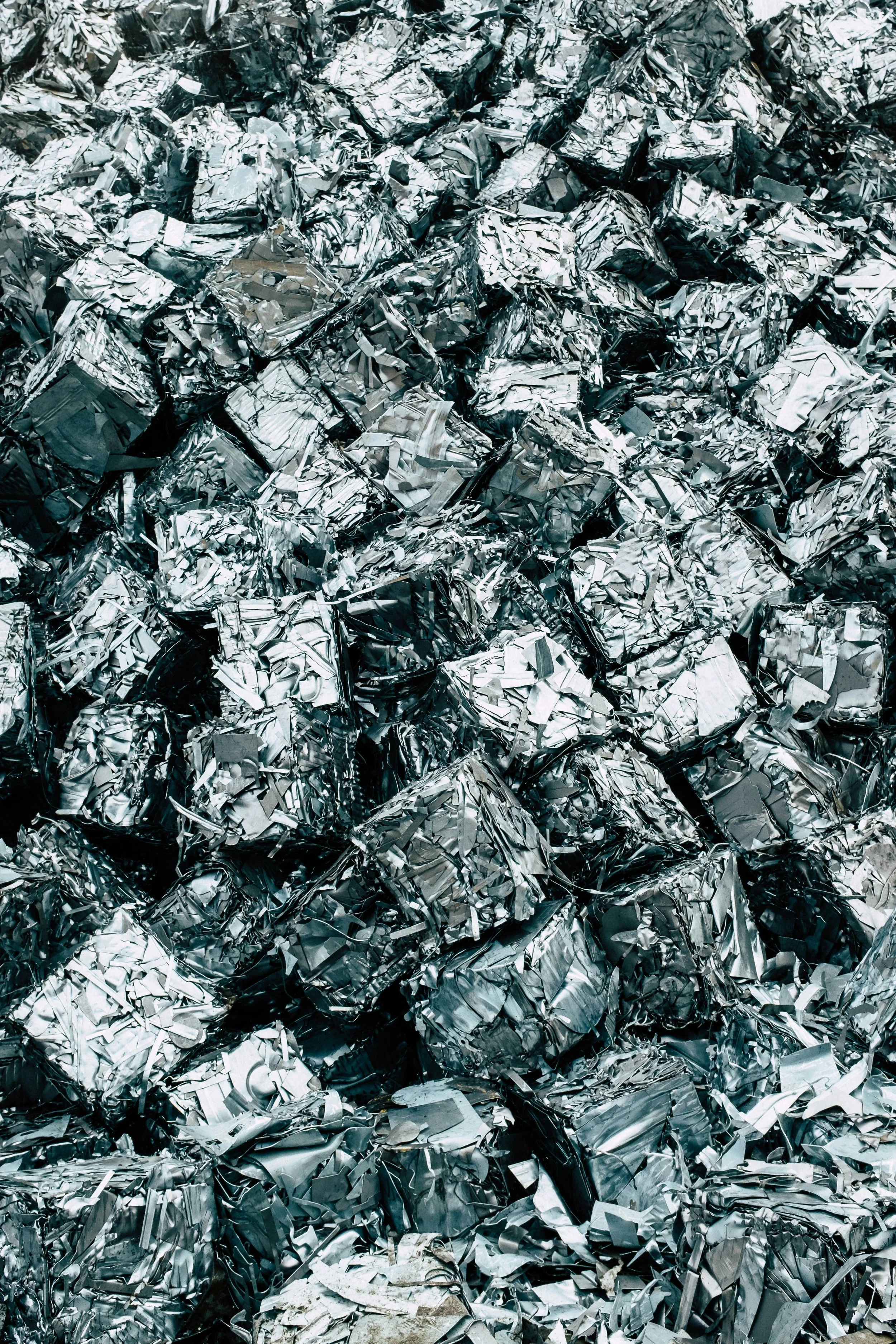 A large pile of crumpled and torn aluminum foil scraps