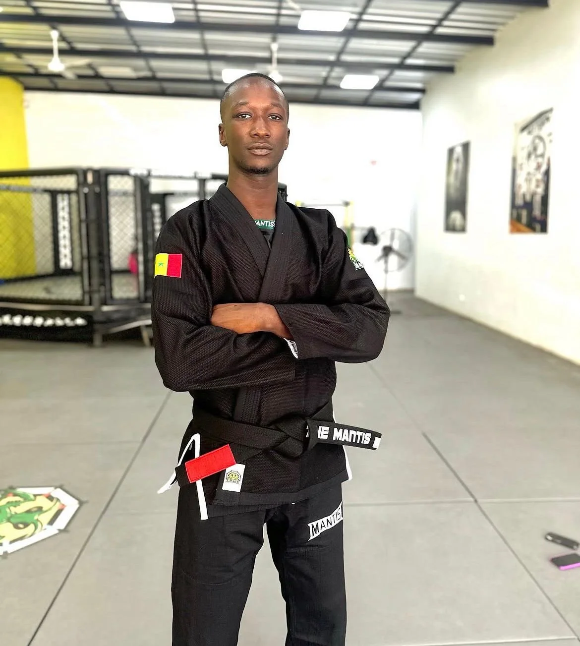 Matar Lo posing inside the Manthis MMA GYM in Dakar, Senegal