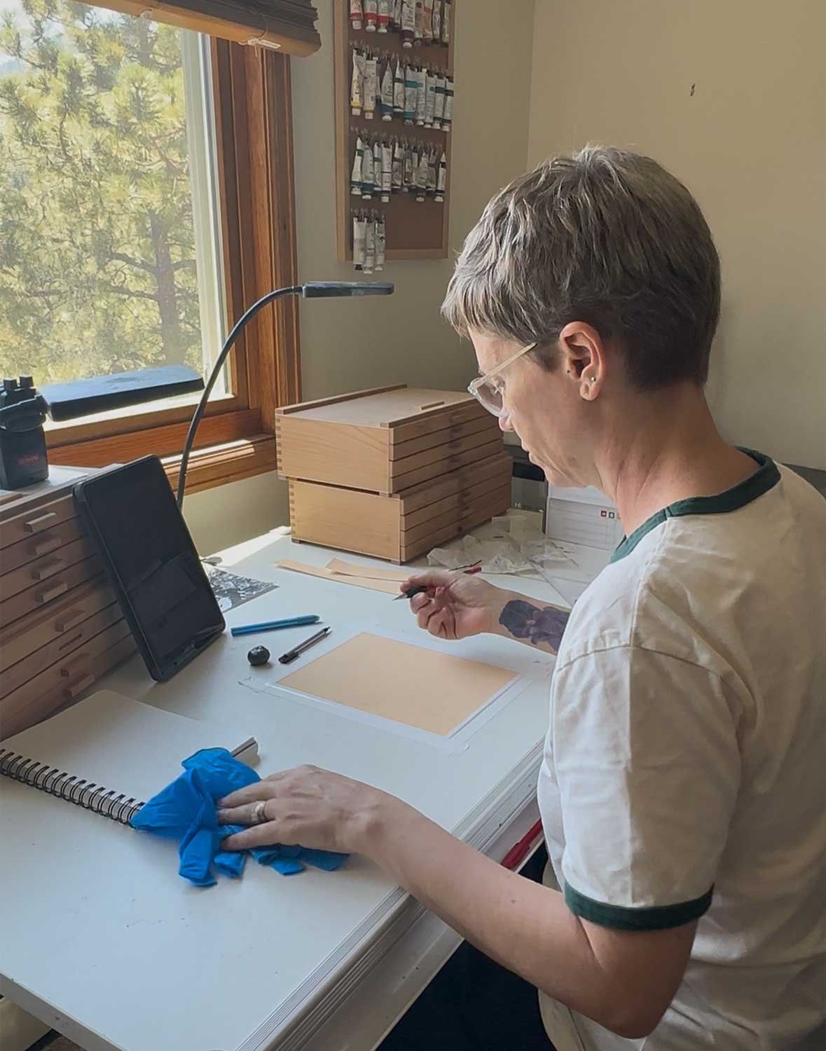 In my art studio, starting work on my newest original oil pastel painting.