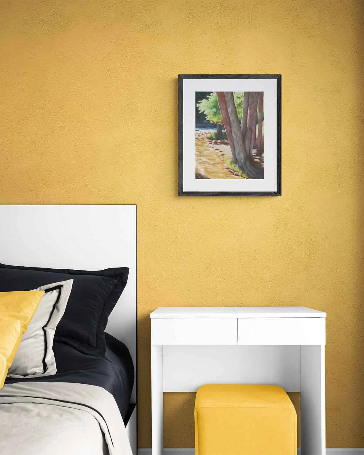 A framed oil pastel painting of a group of trees along a stream in Vail, Colorado.