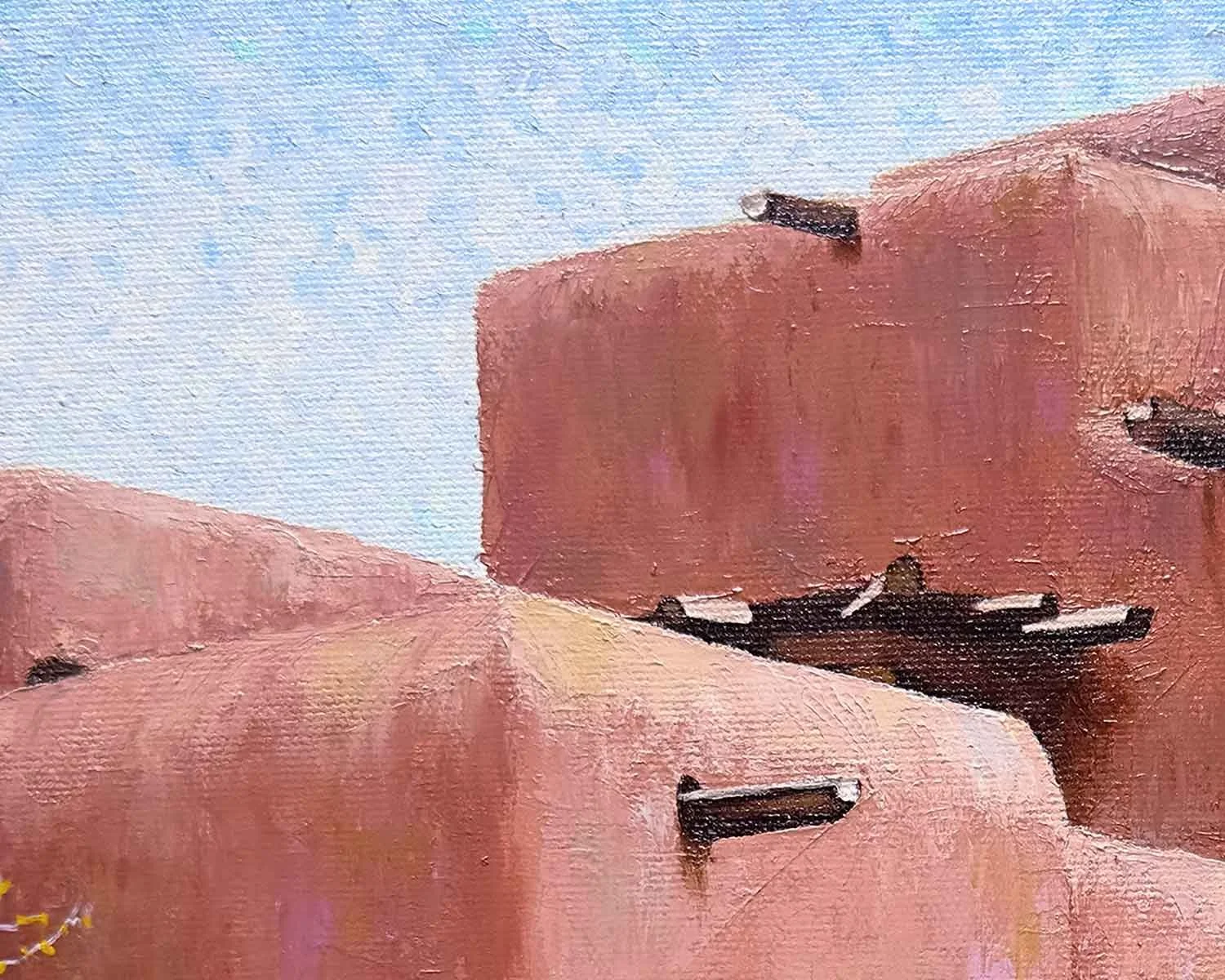 A close up of a palette knife oil painting of the Inn and Spa at Loretto in Santa Fe, New Mexico.