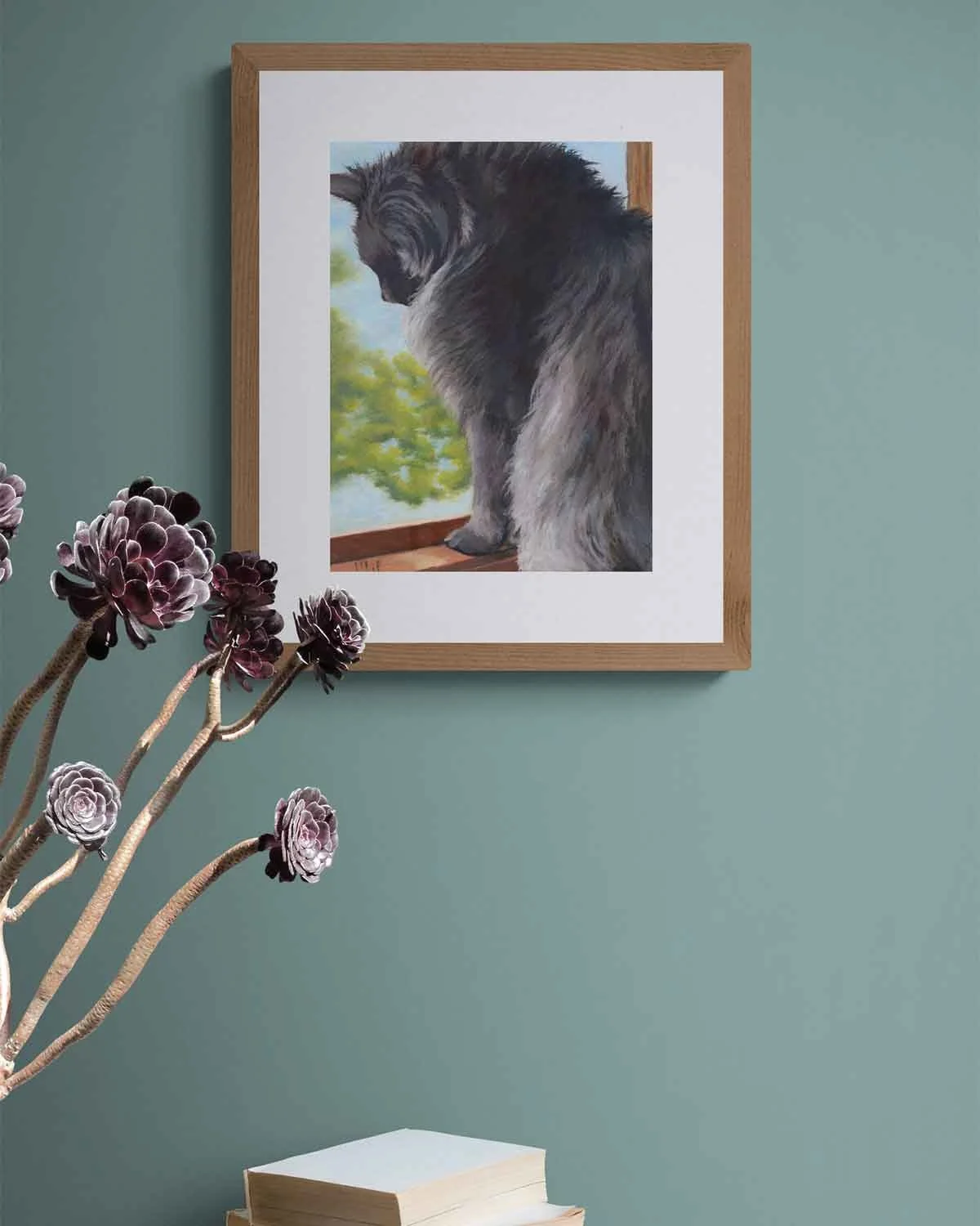 A framed oil pastel painting of a cat looking out a window.