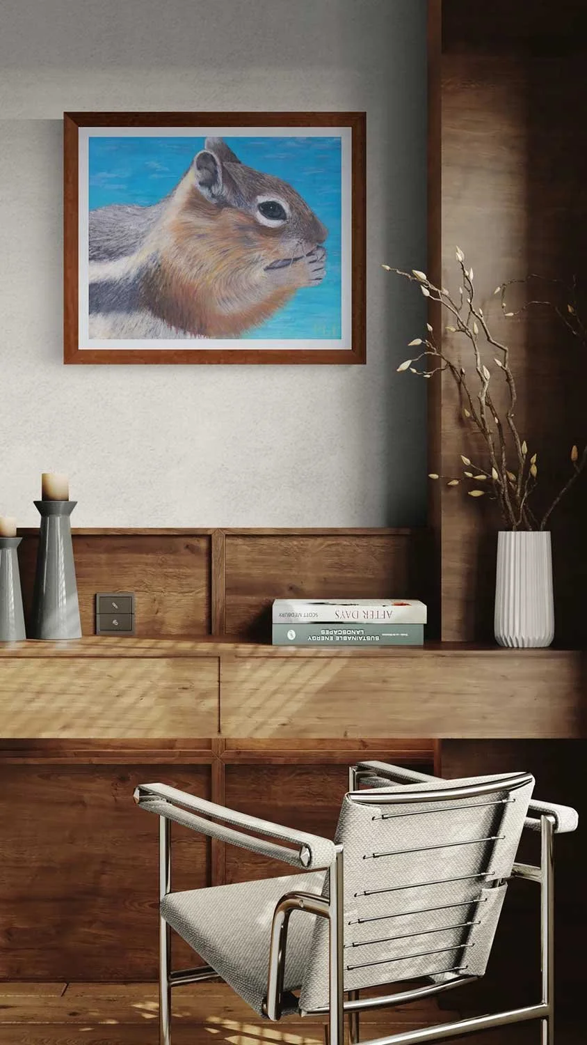 A framed giclée fine art print of an oil pastel painting of a chipmunk at Sapphire Point in Summit County, Colorado.
