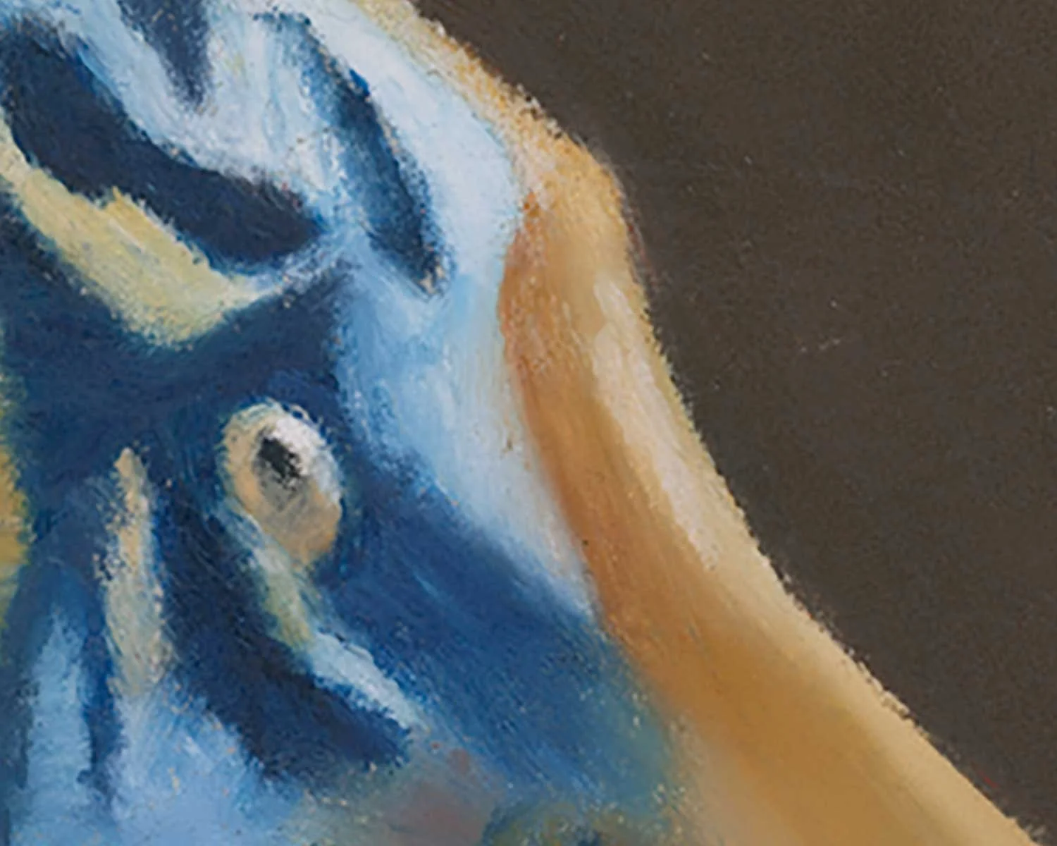 A close up of an oil pastel painting of a tiger in blue and orange.