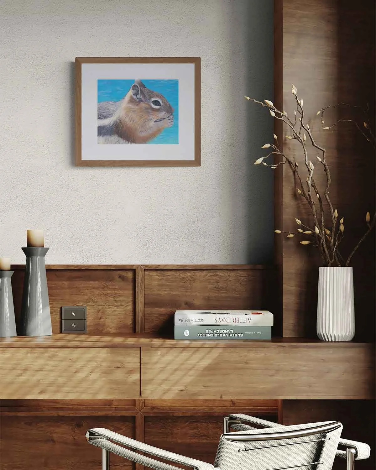 A framed oil pastel painting of a chipmunk at Sapphire Point in Summit County, Colorado.