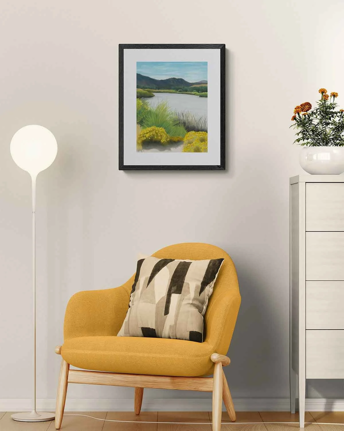A framed oil pastel painting of a pond in Pocatello, Idaho with mountains in the background.