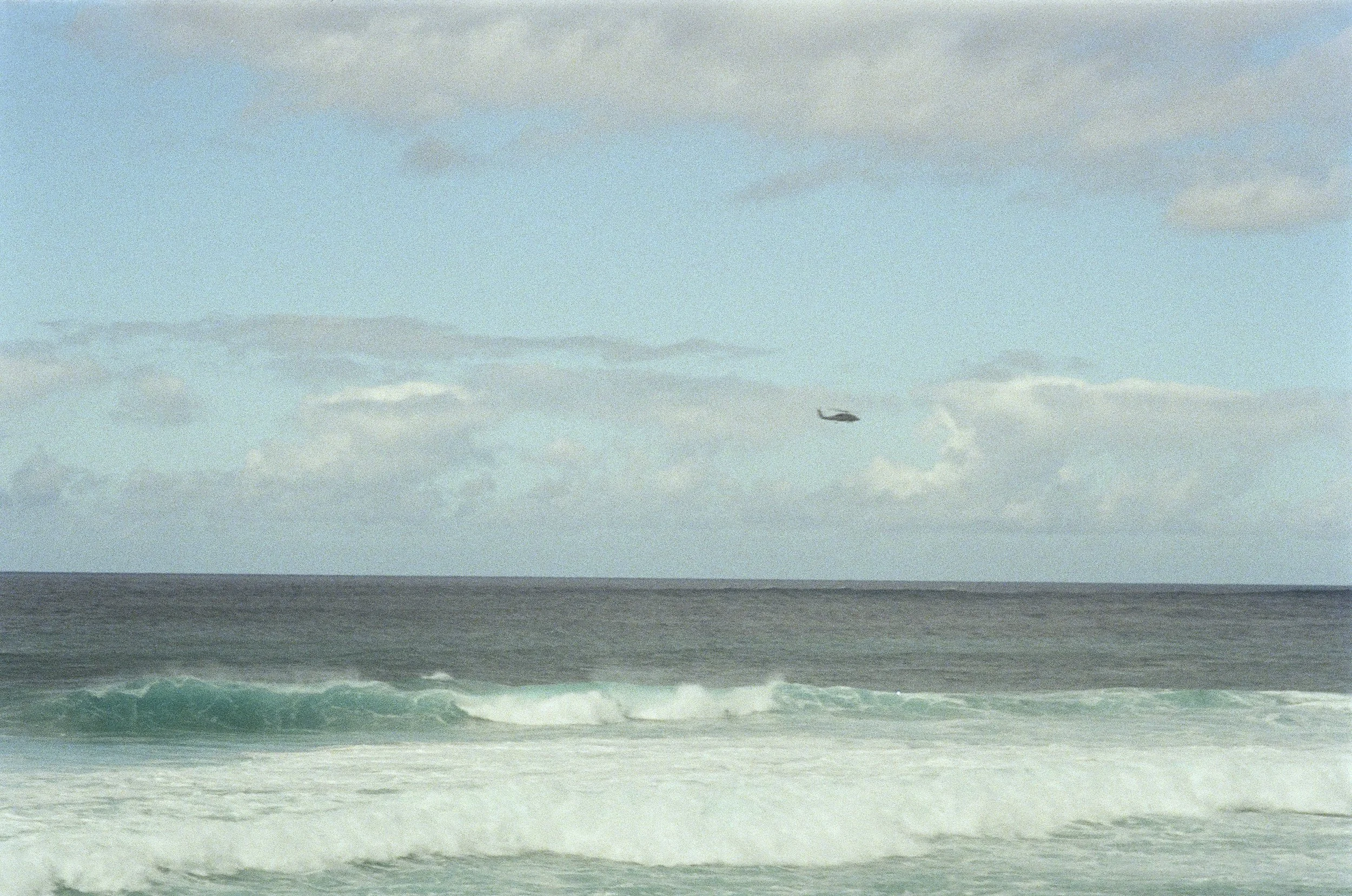 Helicopter Flies Over the Ocean, North Shore, Oahu, HI - Jan. 2025, Kodak Gold 200