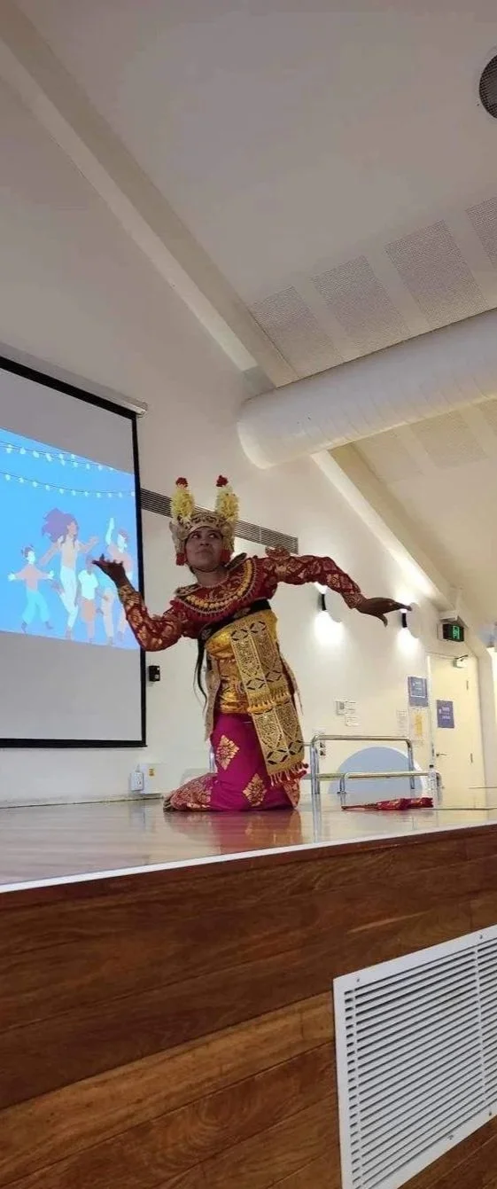A performer dancing at the International Food and Dance Festival