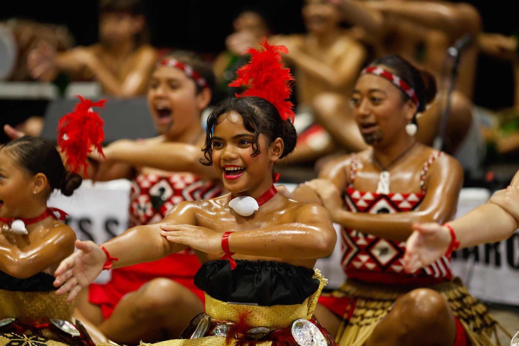 A group of performers dancing at the International Food and Dance Festival.