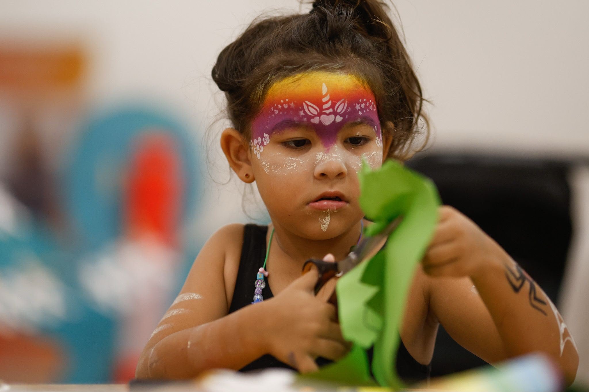 Child enjoying IFAD  crafts.