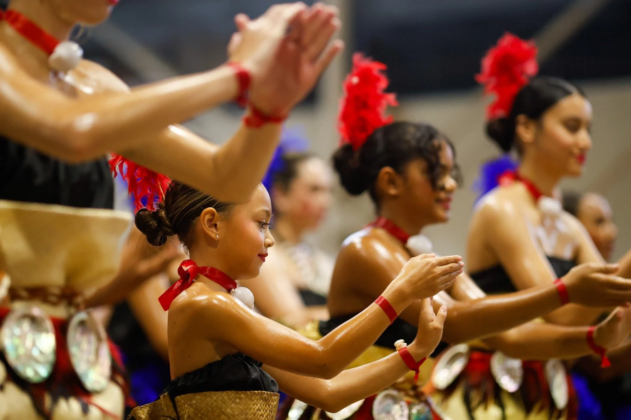 A group of performers dancing at the International Food and Dance Festival.