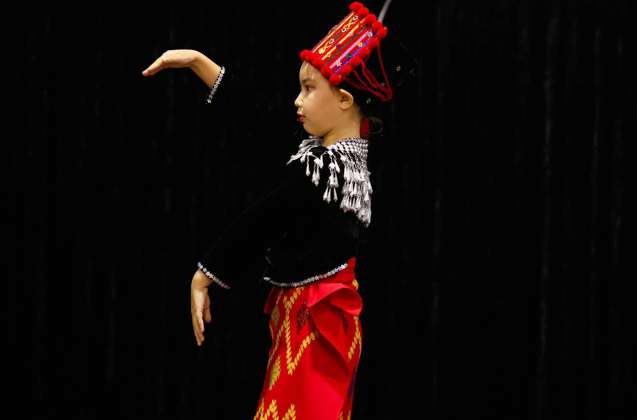 A performer dancing at the International Food and Dance Festival