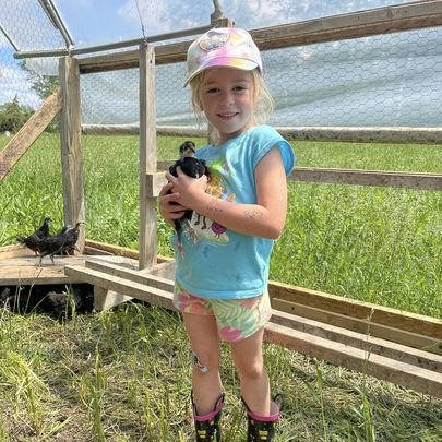 Granddaughter holding chick