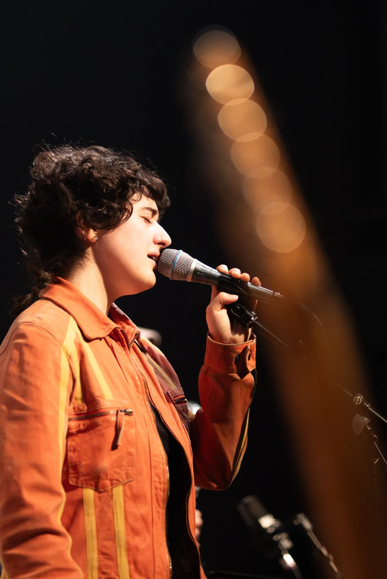 Camille Santacroce singing on-stage during one of her many concerts in Switzerland.
