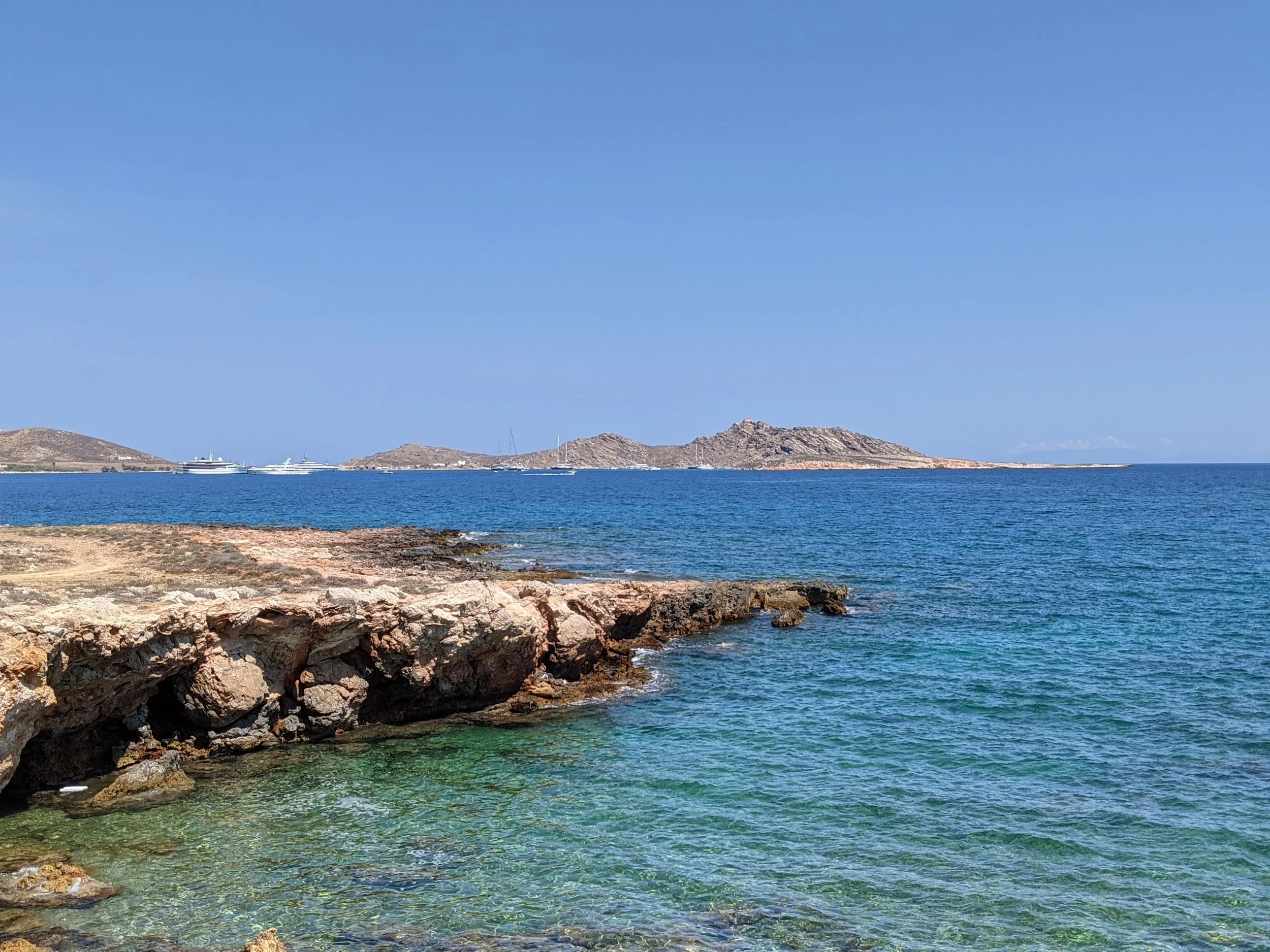 See the coast, downtown Naoussa, and Mykonos twinkling in the night right outside the door at Paros Paradise!