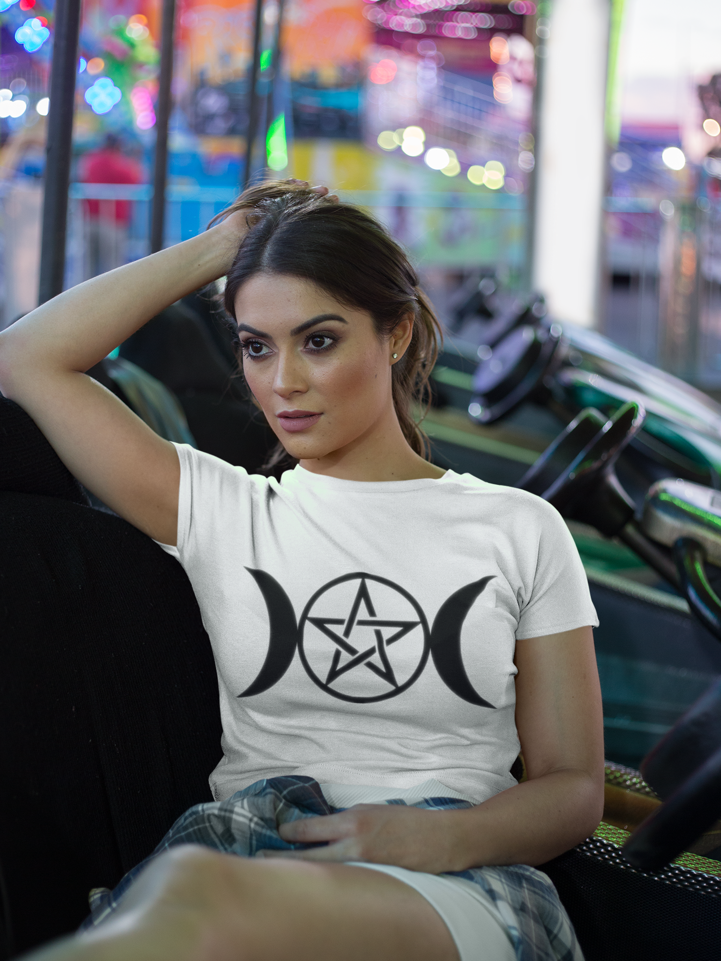 crop-top-tee-mockup-being-worn-by-a-girl-lying-on-the-arcade-car-games-a19440.png