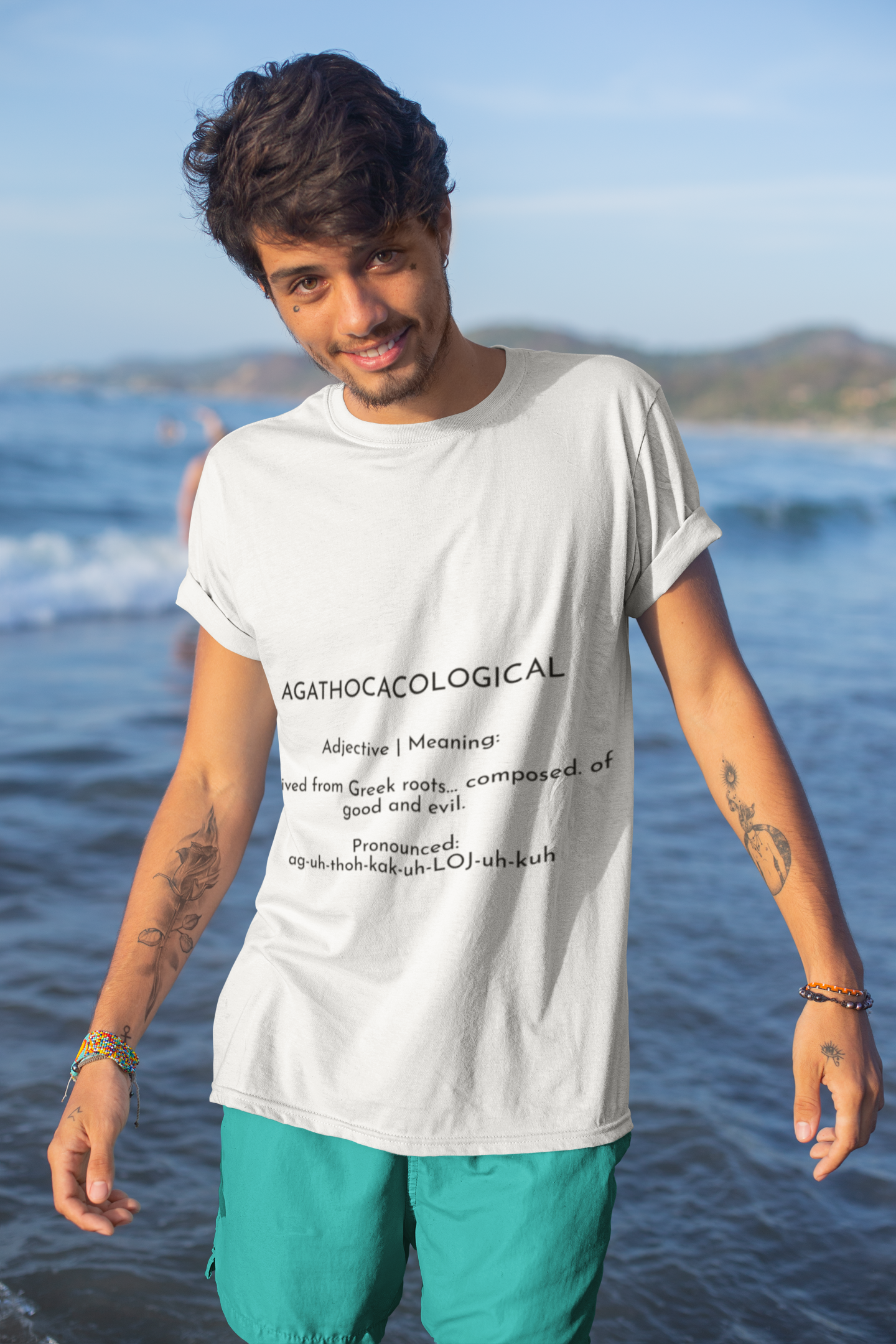 mockup-of-a-tattooed-young-man-by-the-sea-wearing-a-t-shirt-26767.png