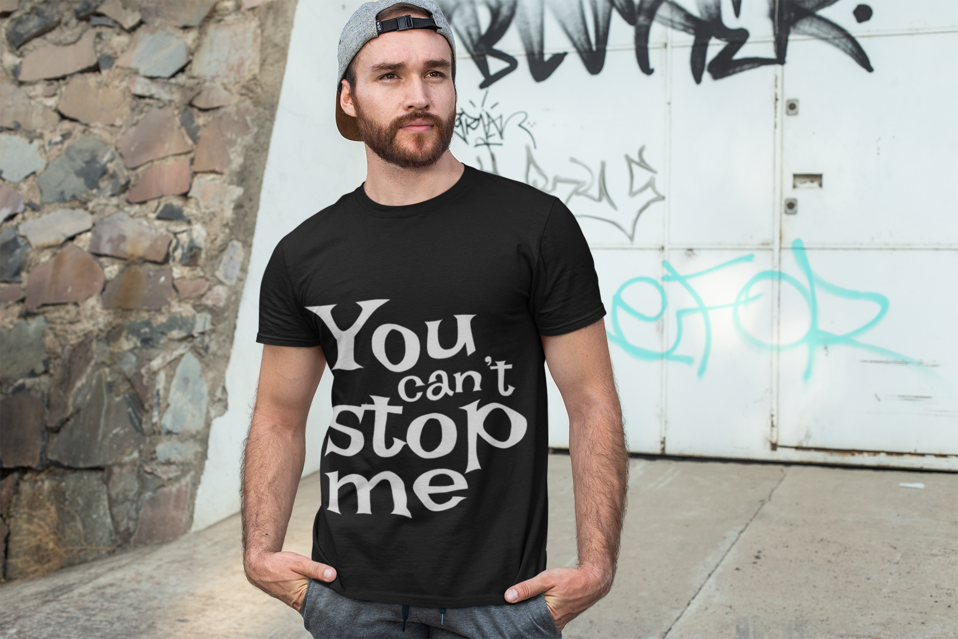 t-shirt-mockup-of-a-man-posing-in-front-of-a-graffiti-wall-28200.png
