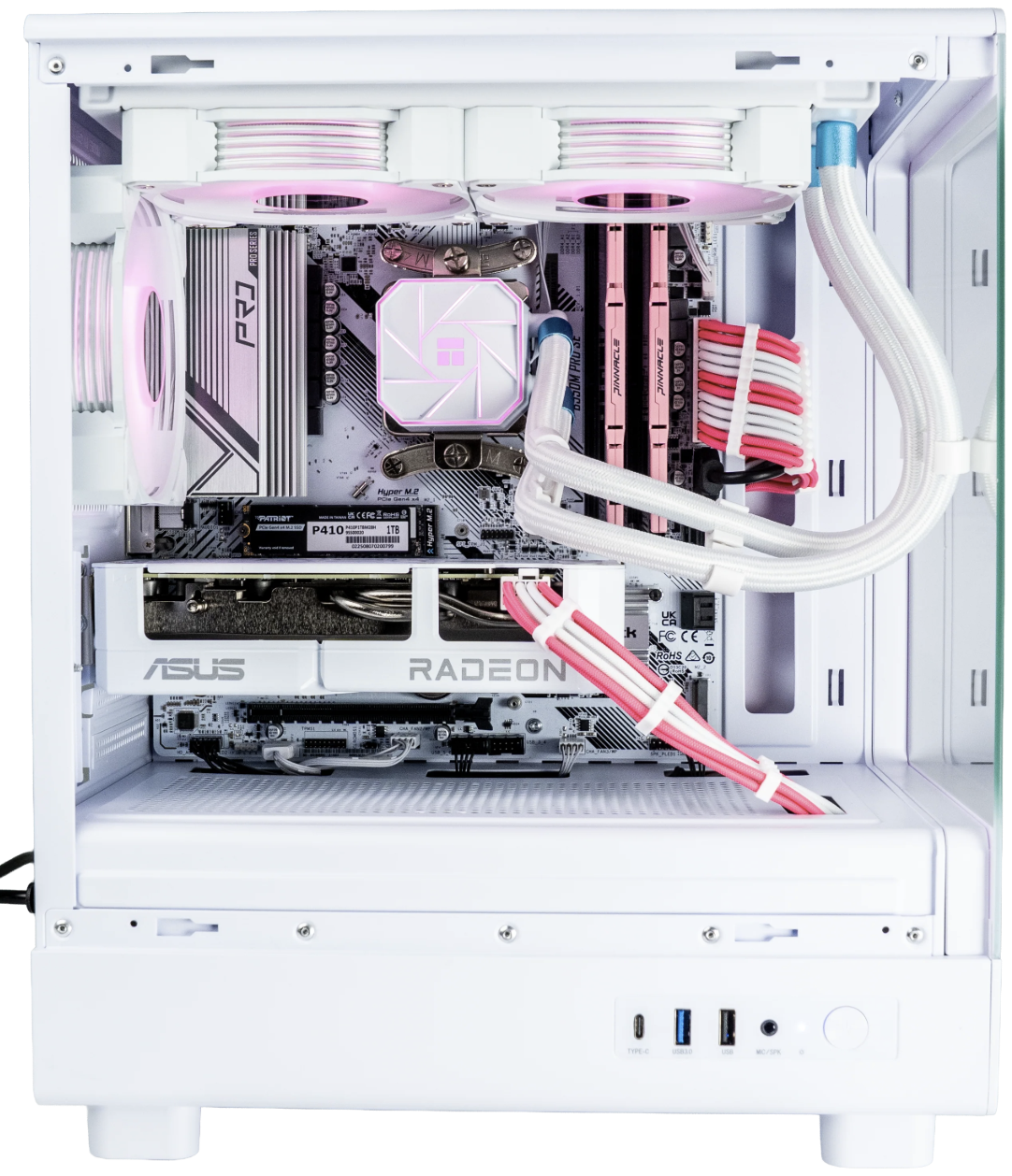 Interior of a custom high-performance gaming or streaming computer with white case, pink and white cable sleeving, water cooling, DDR4 RAM, SSD, and a Radeon graphics card.