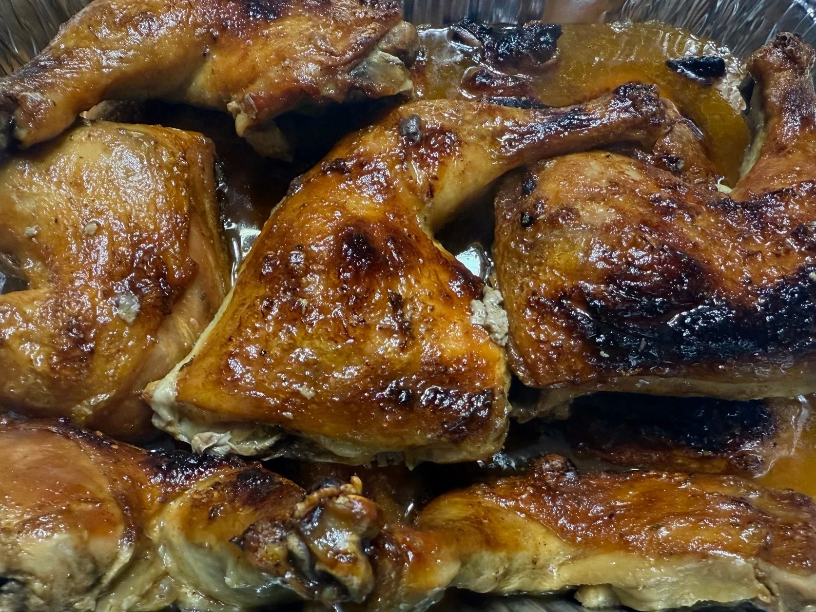 Cooked chicken pieces in a baking dish