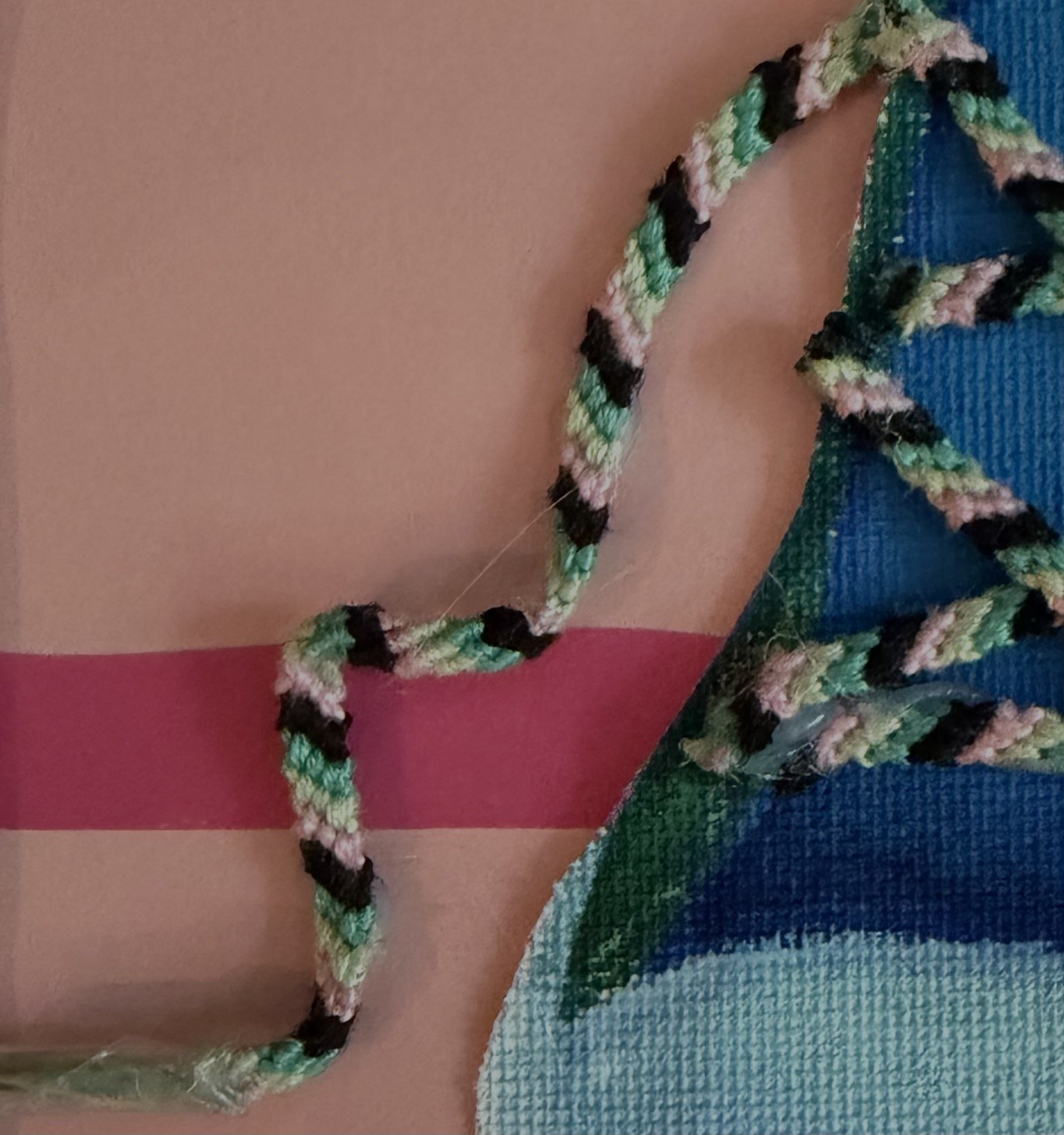 Close-up of a painting of a shoe with textured shoelaces.