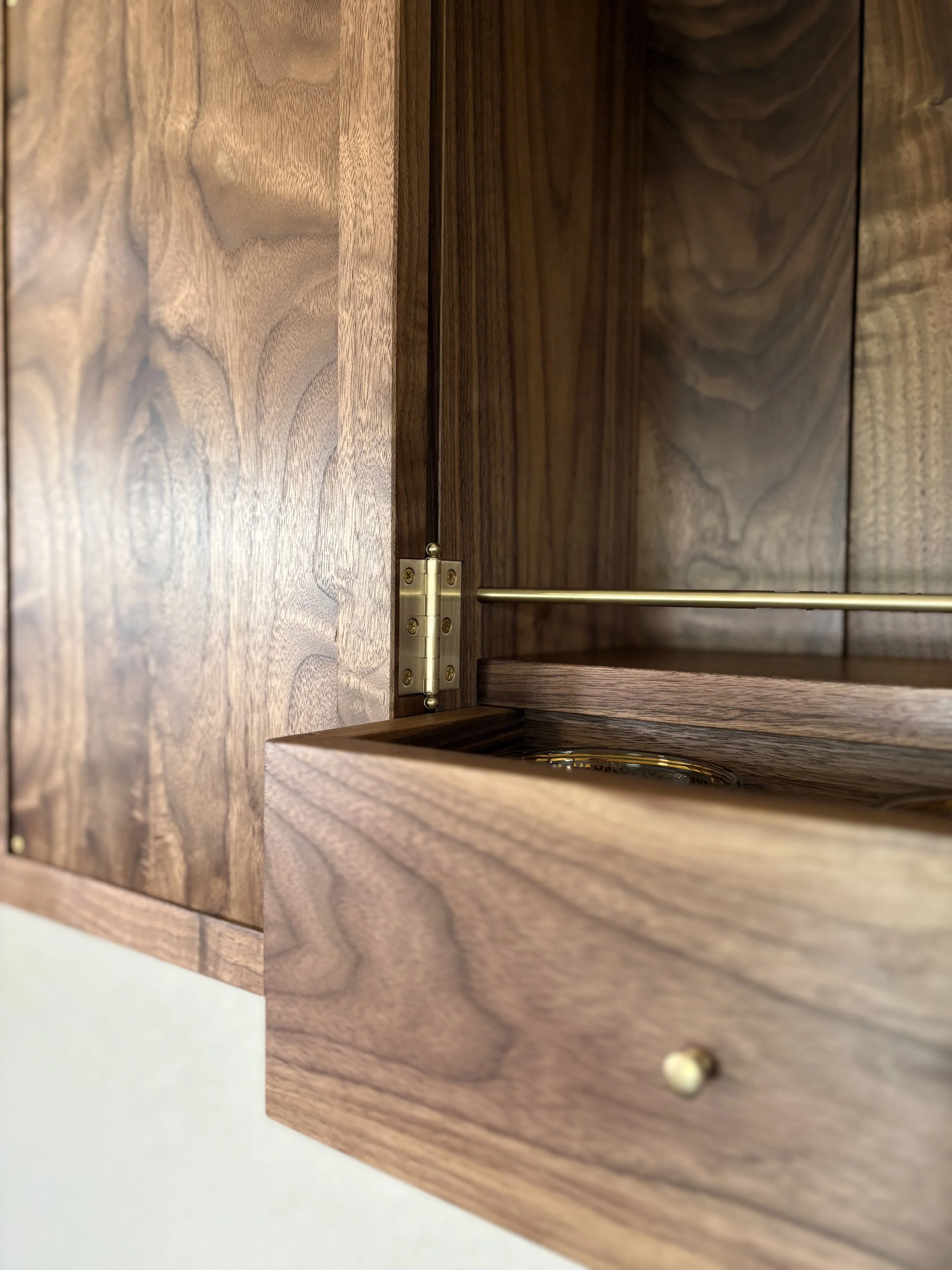 The hinges are solid brass. They fit in a slot hand cut with chisels for a clean and classy look. 