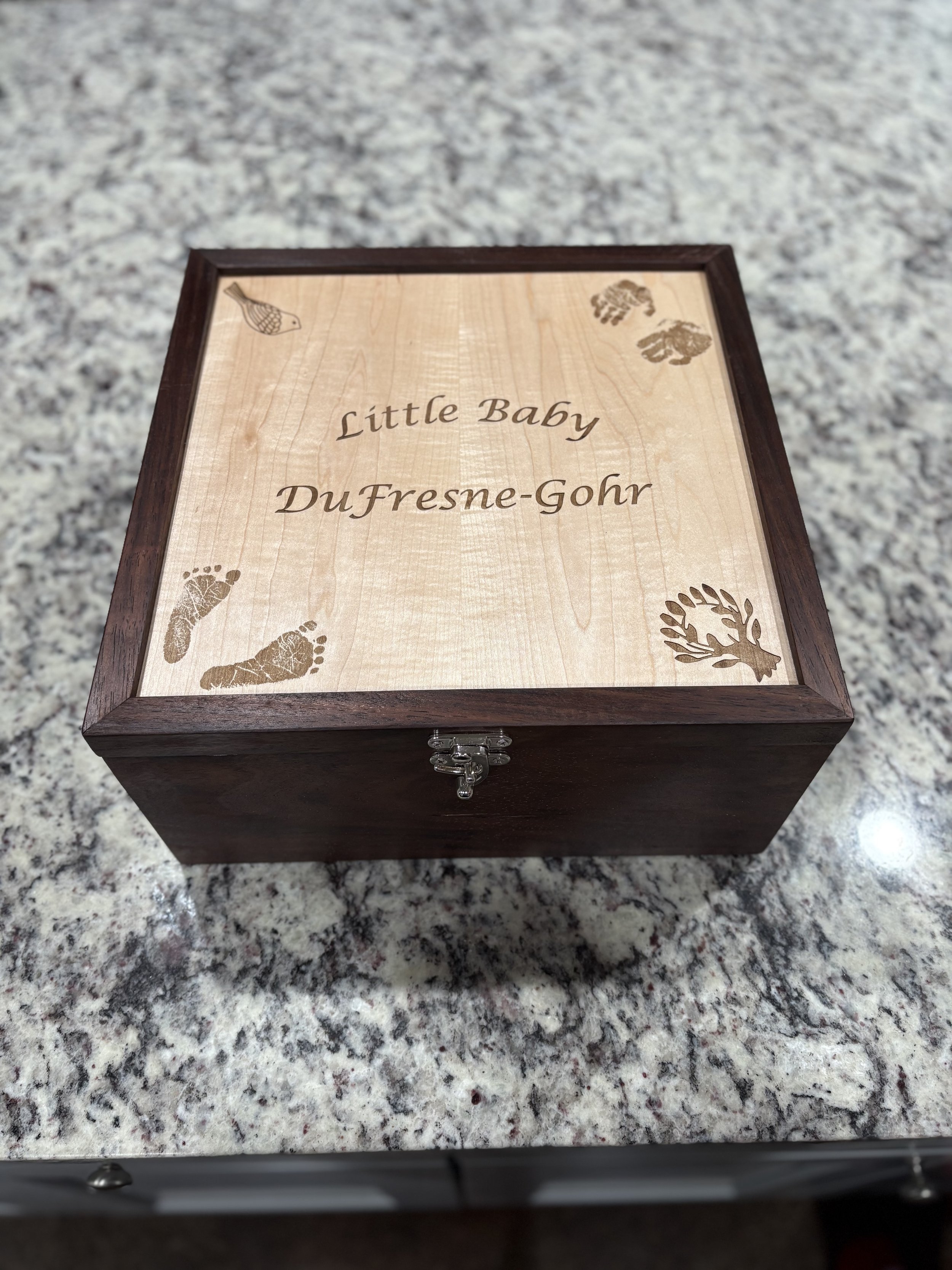 Per the clients request, the top is laser engrave with actual hand and foot prints. 