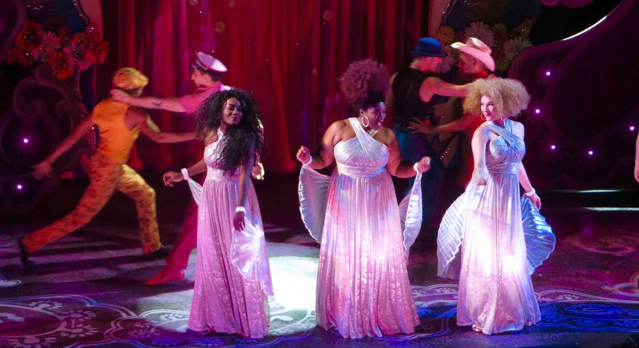 The Divas (Sara Burke, Chanel Haynes-Schwartz, and Abena Mensah-Bonsu), a tree that run through the entire show, are quite glorious!

- Austin Chronicle by Frank Benge