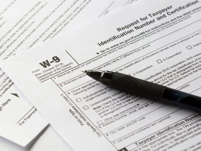 Tax form WO-9 with a black pen on top of it.