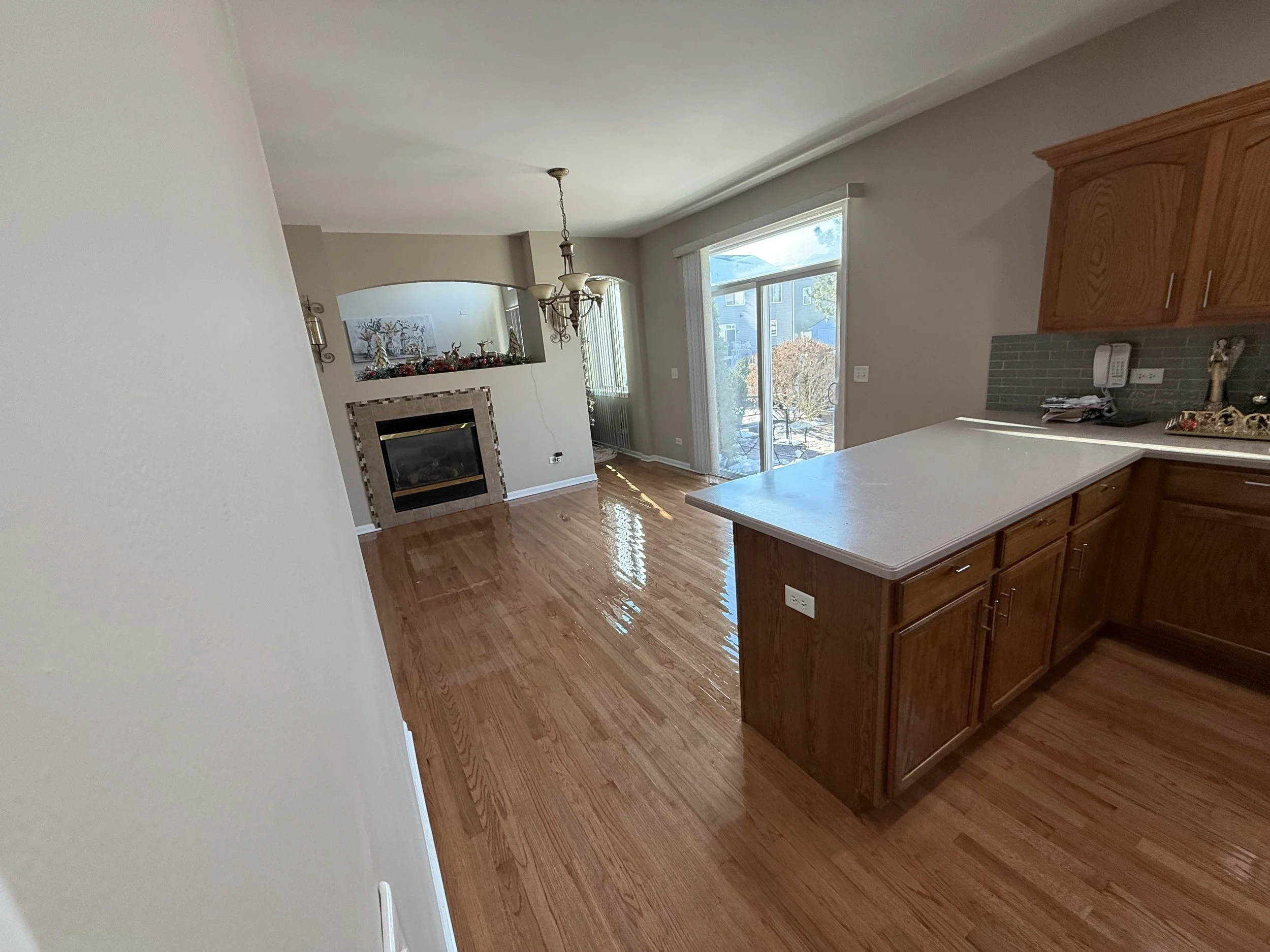 Refinished hardwood flooring with restored natural color and a durable protective finish