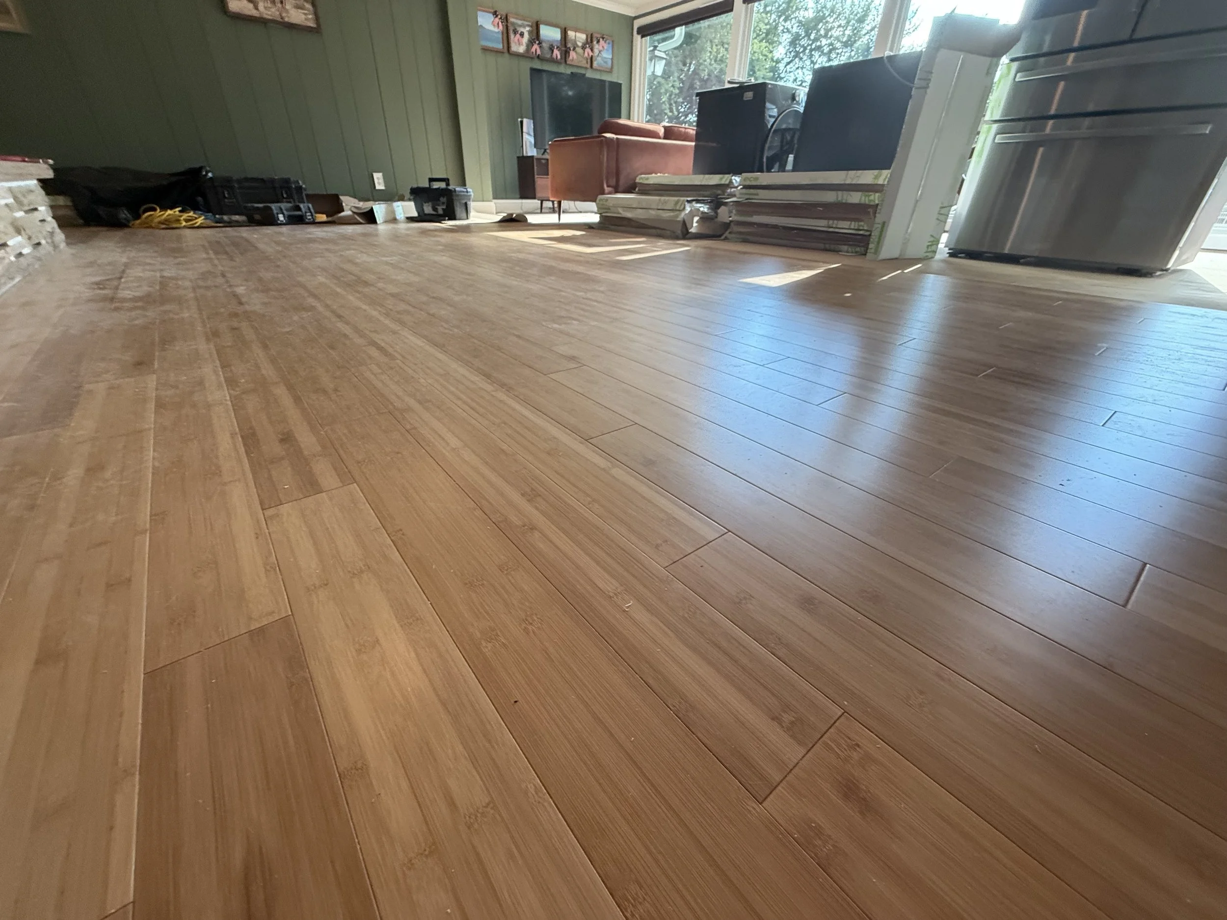 Refinished hardwood floor with an even satin protective coating