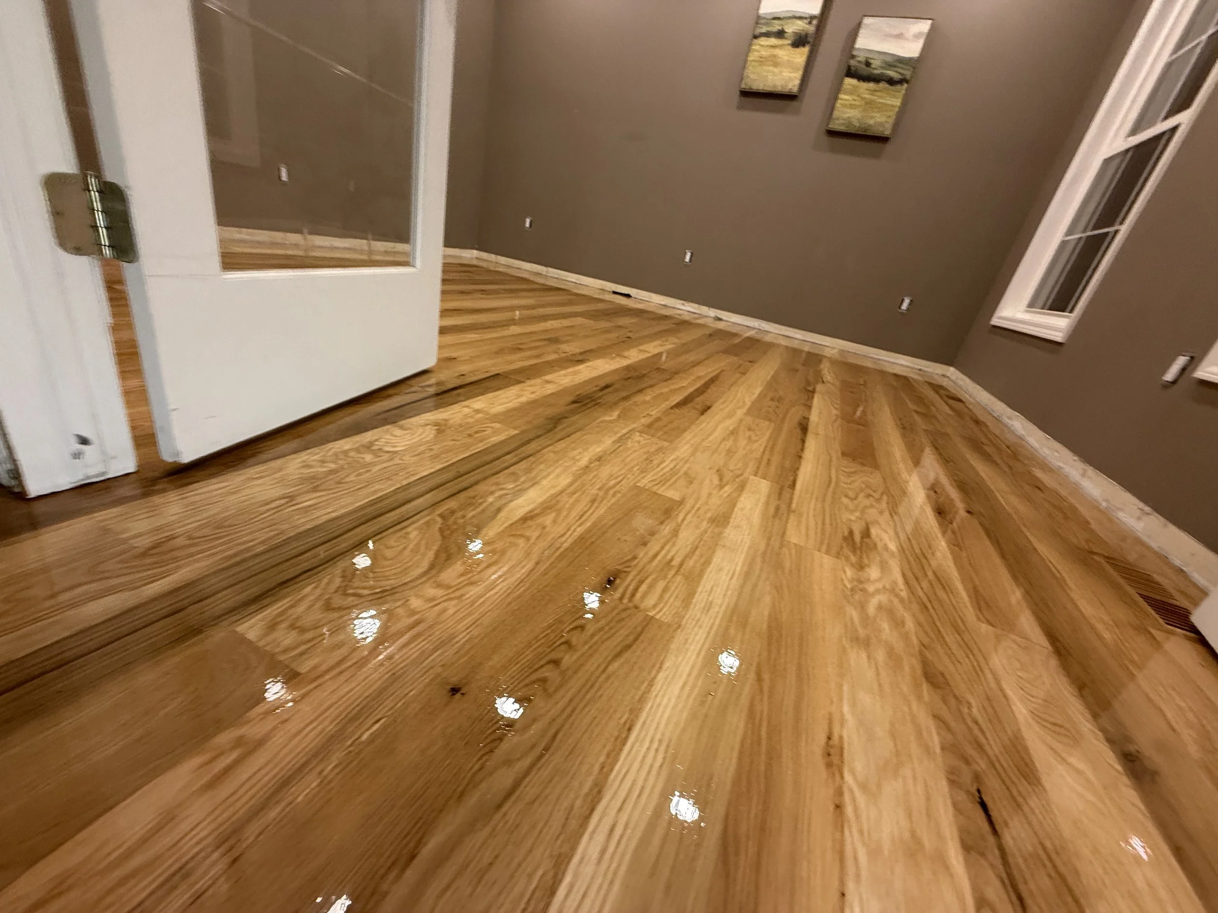 Restored hardwood floor with a rich even tone and a durable protective coating