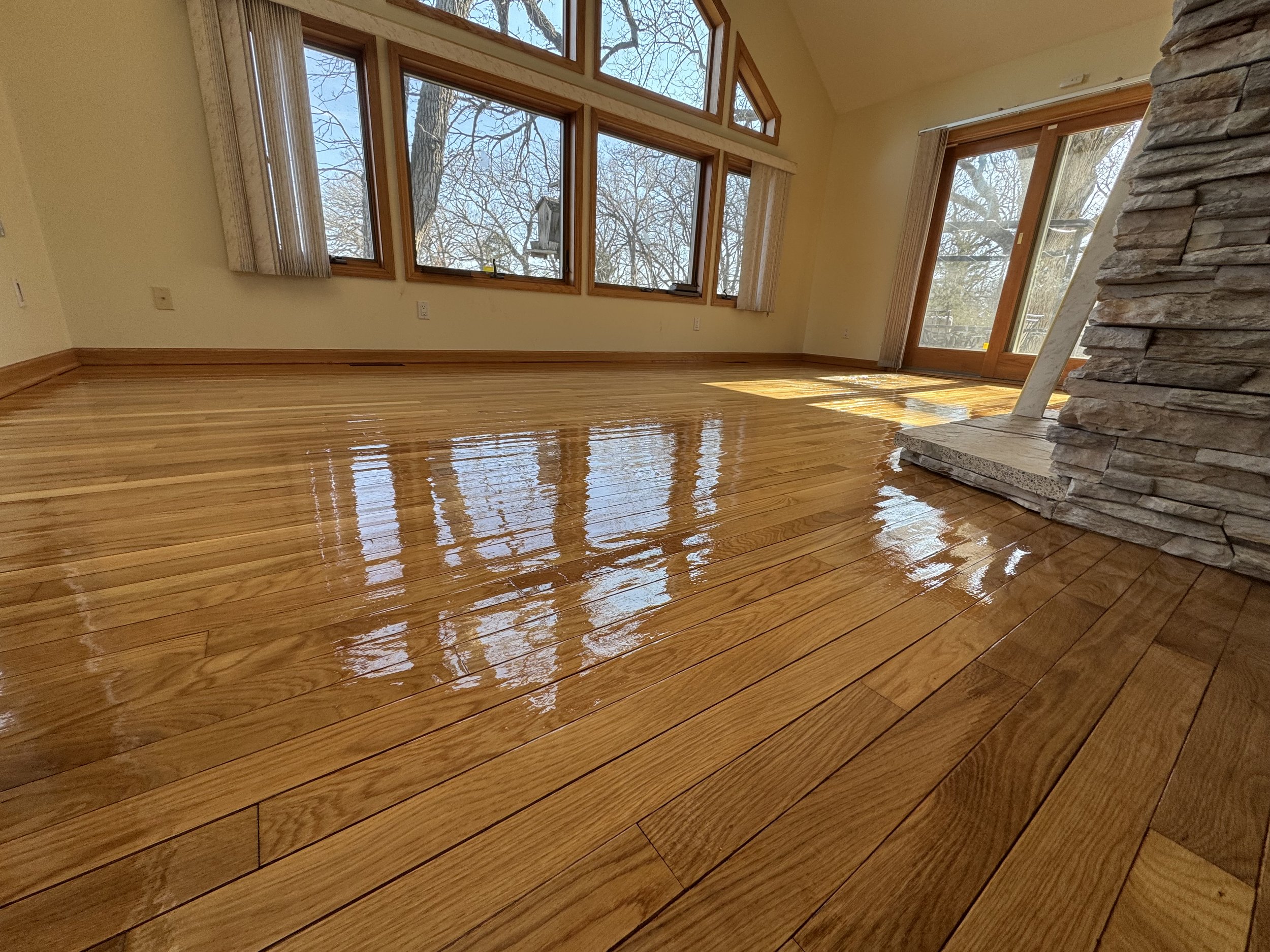 Newly refinished hardwood floor with a rich natural wood finish