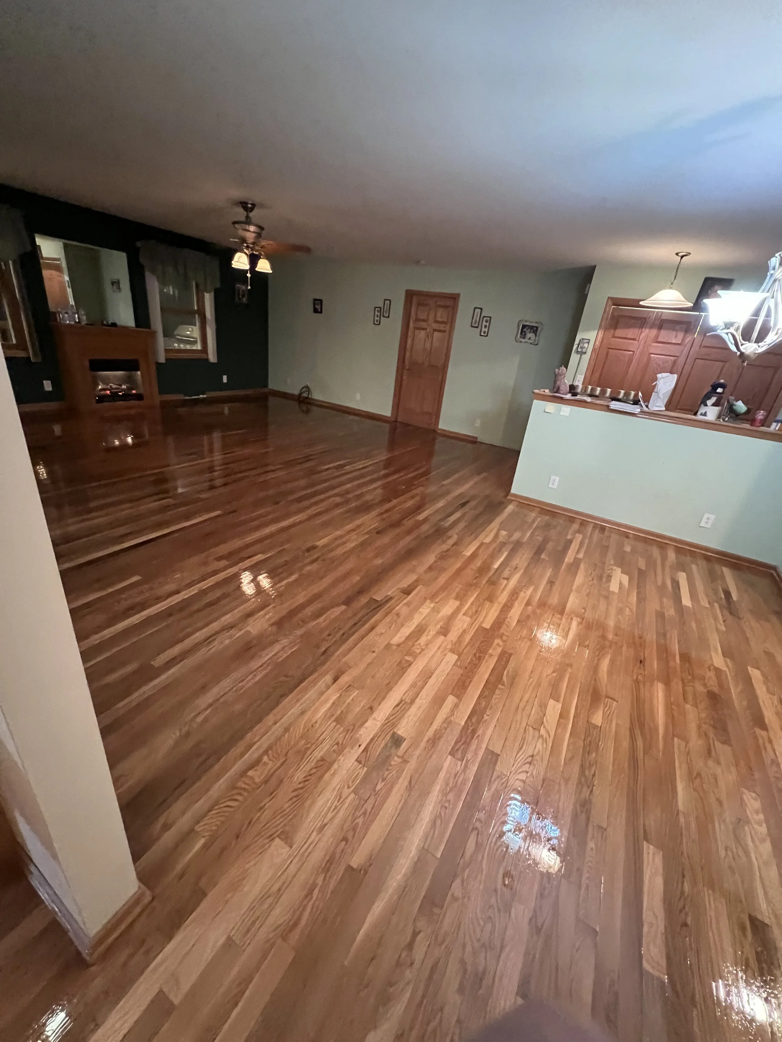 Freshly refinished hardwood flooring with a clean satin finish