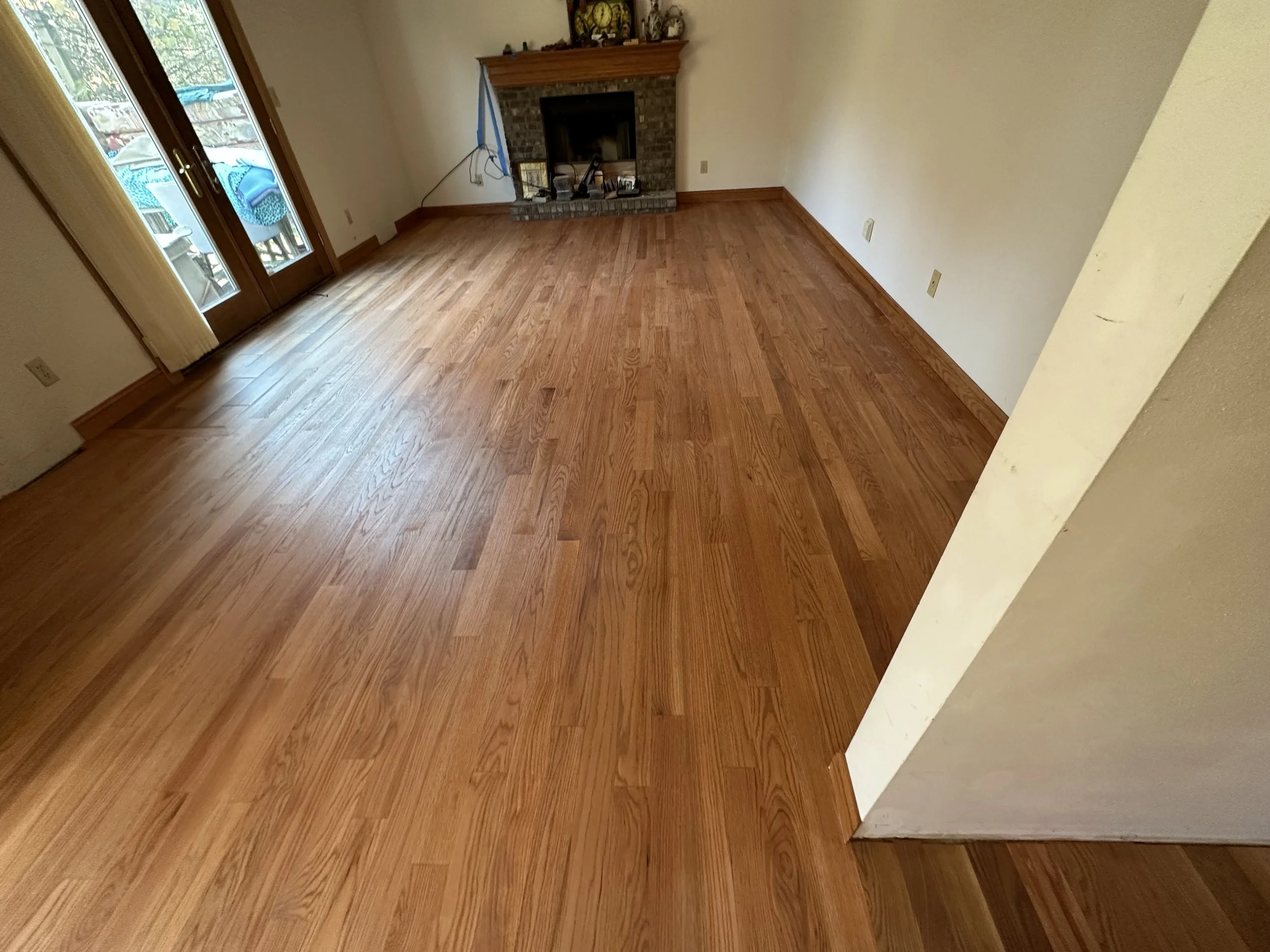 Refinished hardwood flooring with a natural warm sheen