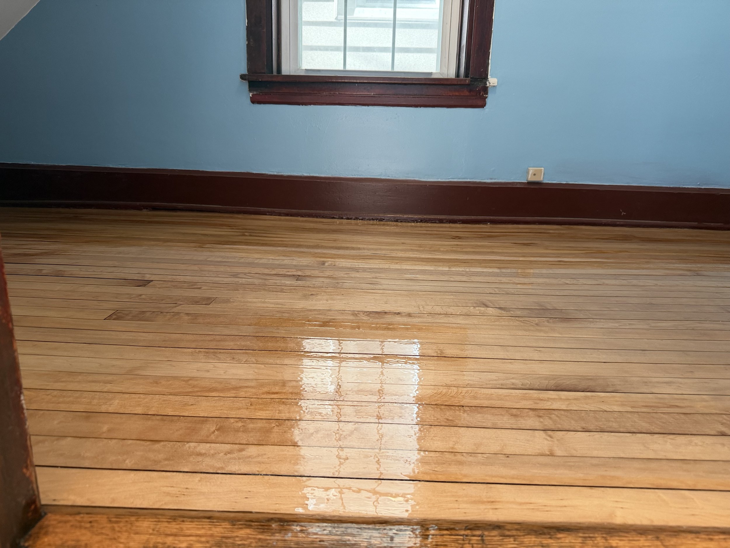 Restored hardwood flooring with renewed natural color and durable protective finish in a Homer Glen home