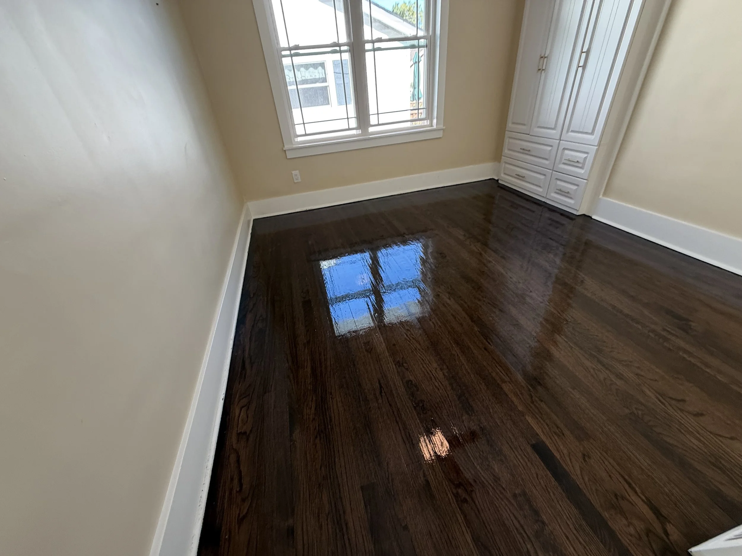 Refinished hardwood floor with a smooth protective finish