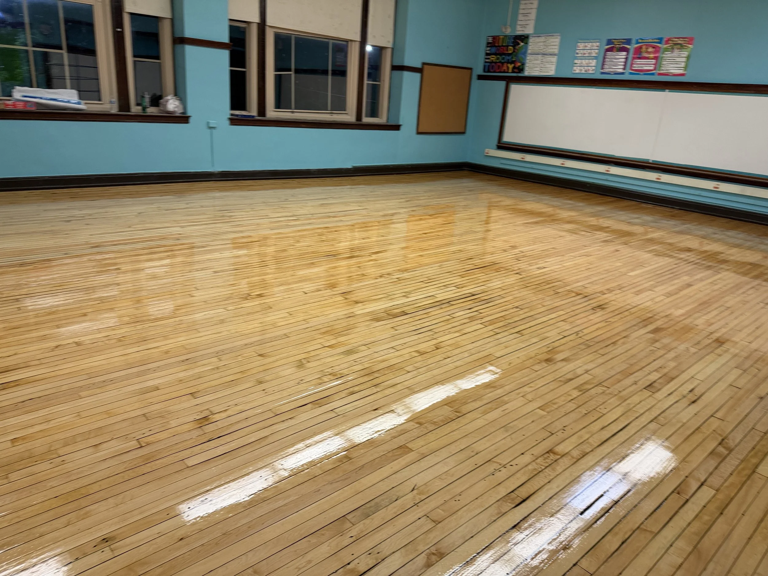 Hardwood floor refinished with a renewed natural wood tone and durable protective finish in a Woodridge home