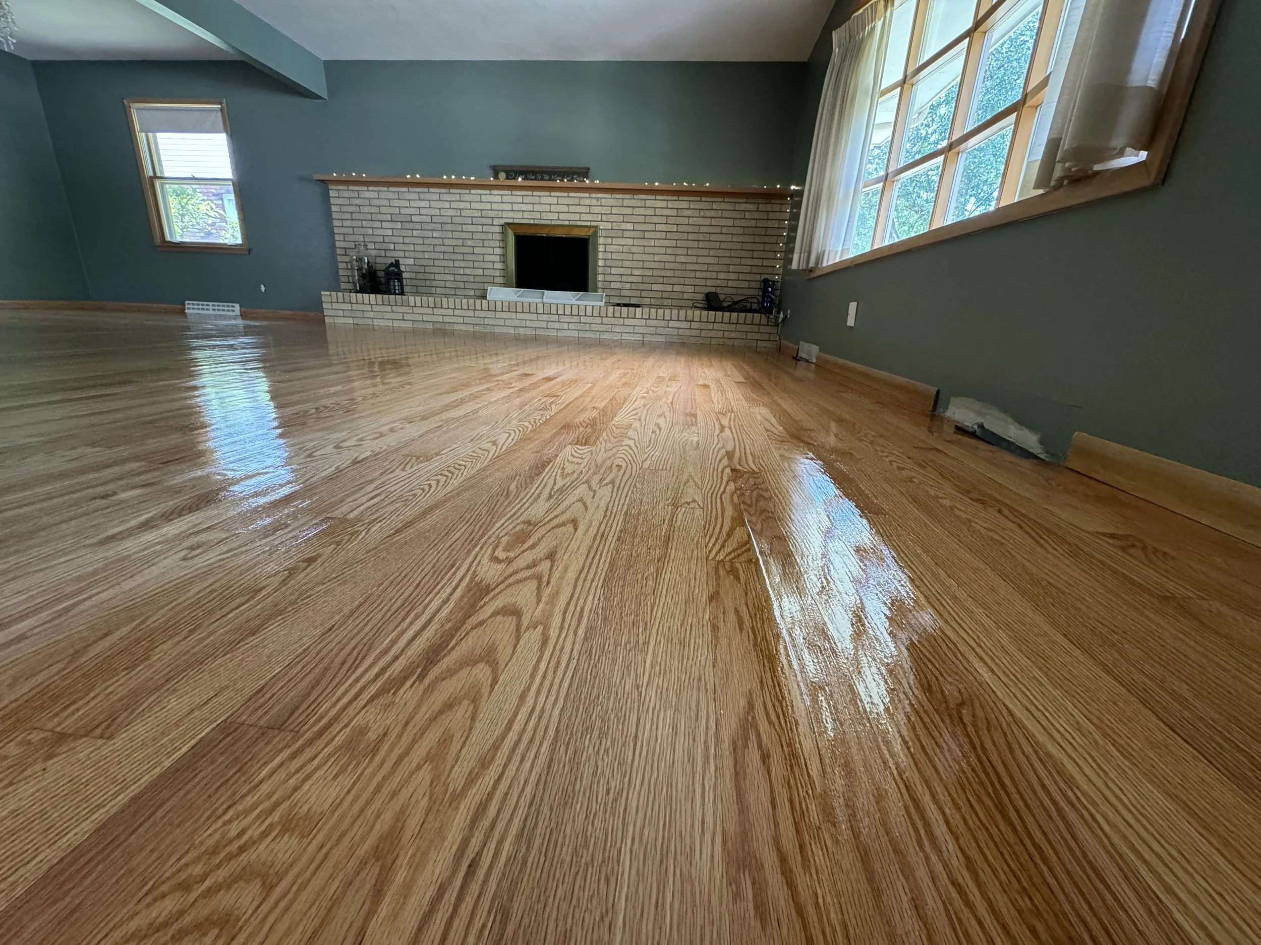 Refinished hardwood floor with a glossy finish