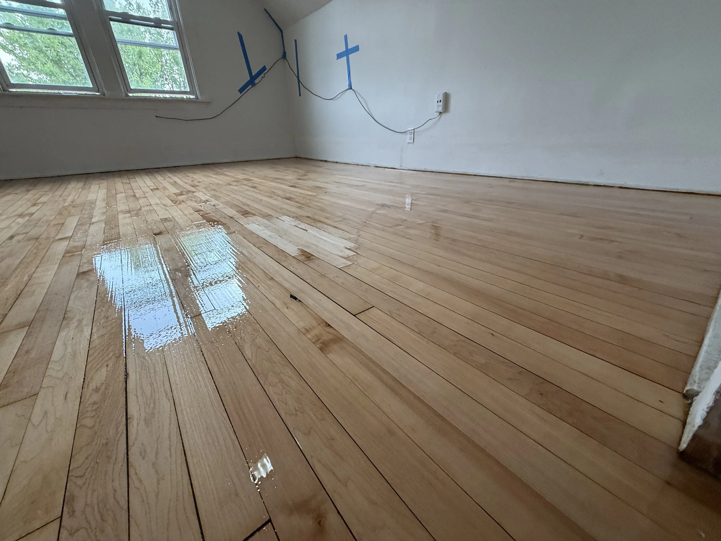 Hardwood flooring refinished with renewed natural color and a durable protective finish in a Burr Ridge home