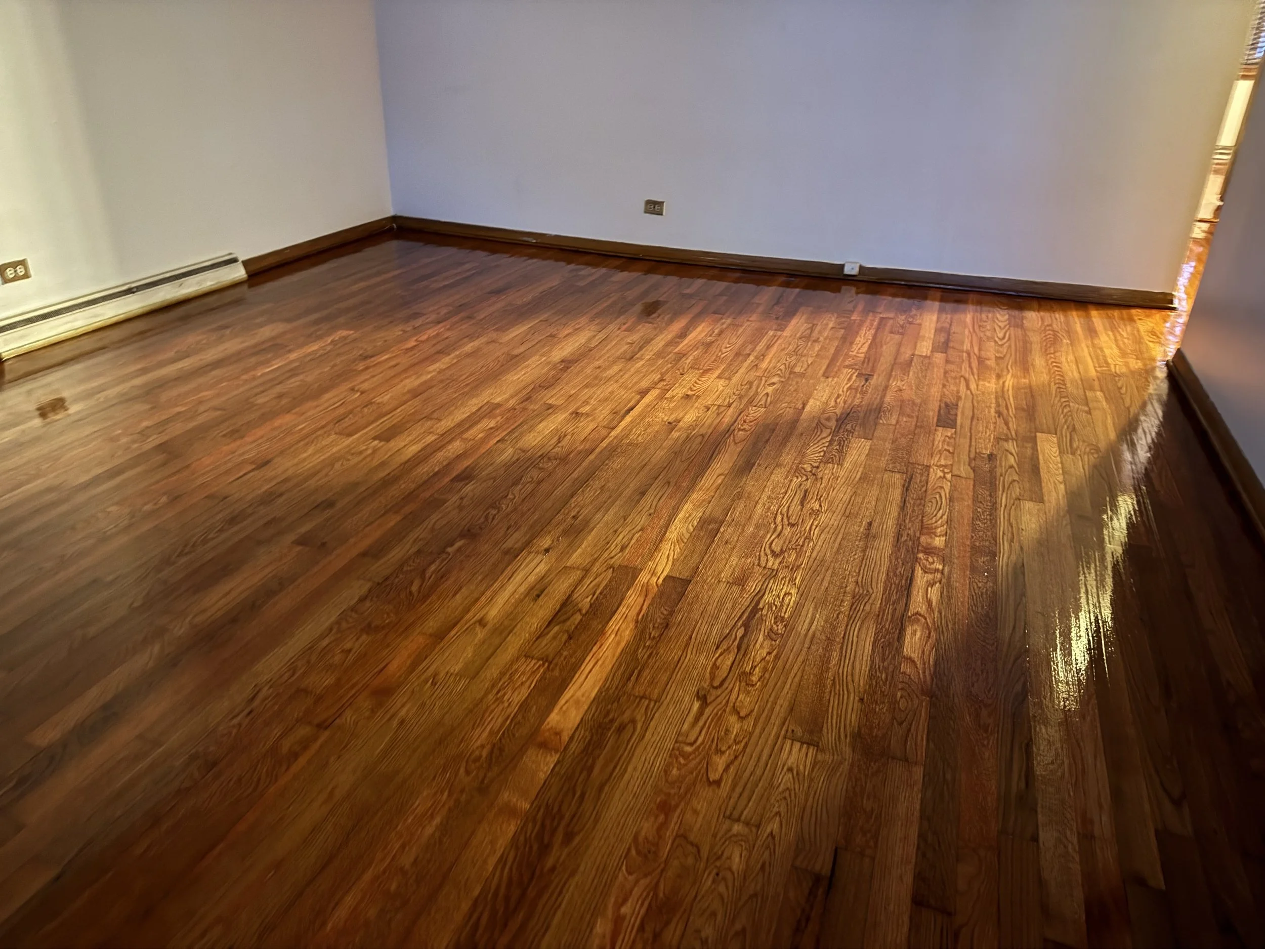 Professionally refinished hardwood floors in Poplar Grove, IL by Cristian Maxin Flooring