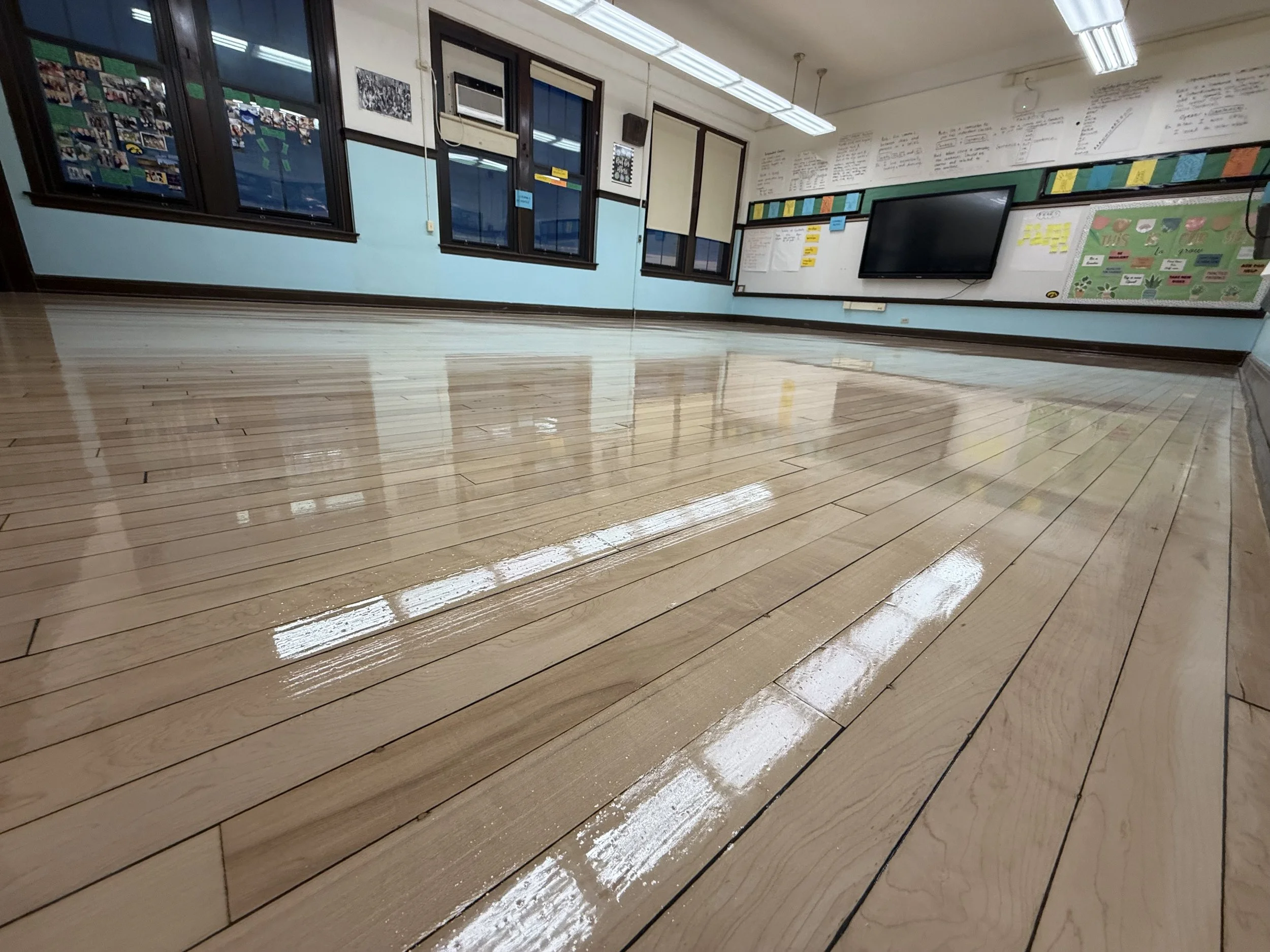 Refinished hardwood flooring with restored color and a durable protective finish in a Bolingbrook home