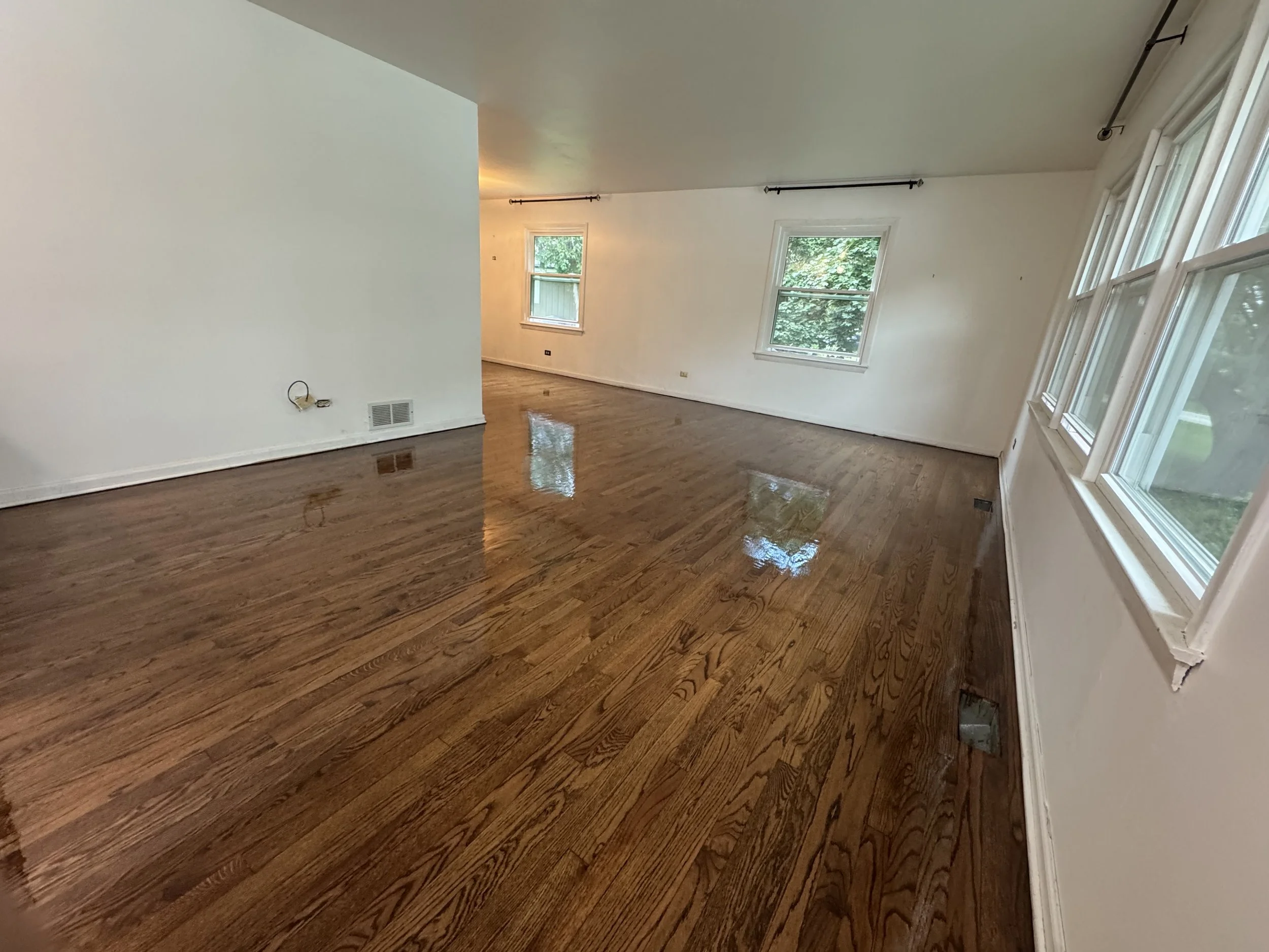 Refinished hardwood floor with a smooth, durable finish