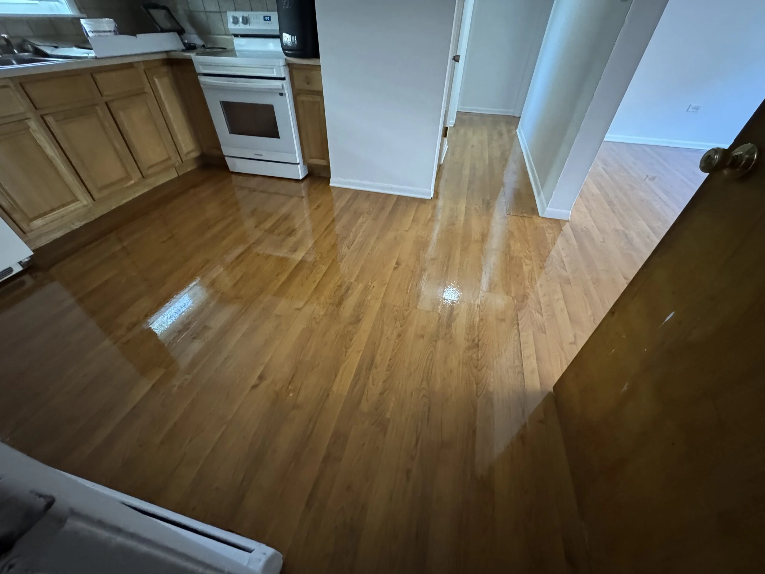 Hardwood flooring refinished with restored natural color and a durable protective finish in a Homewood home