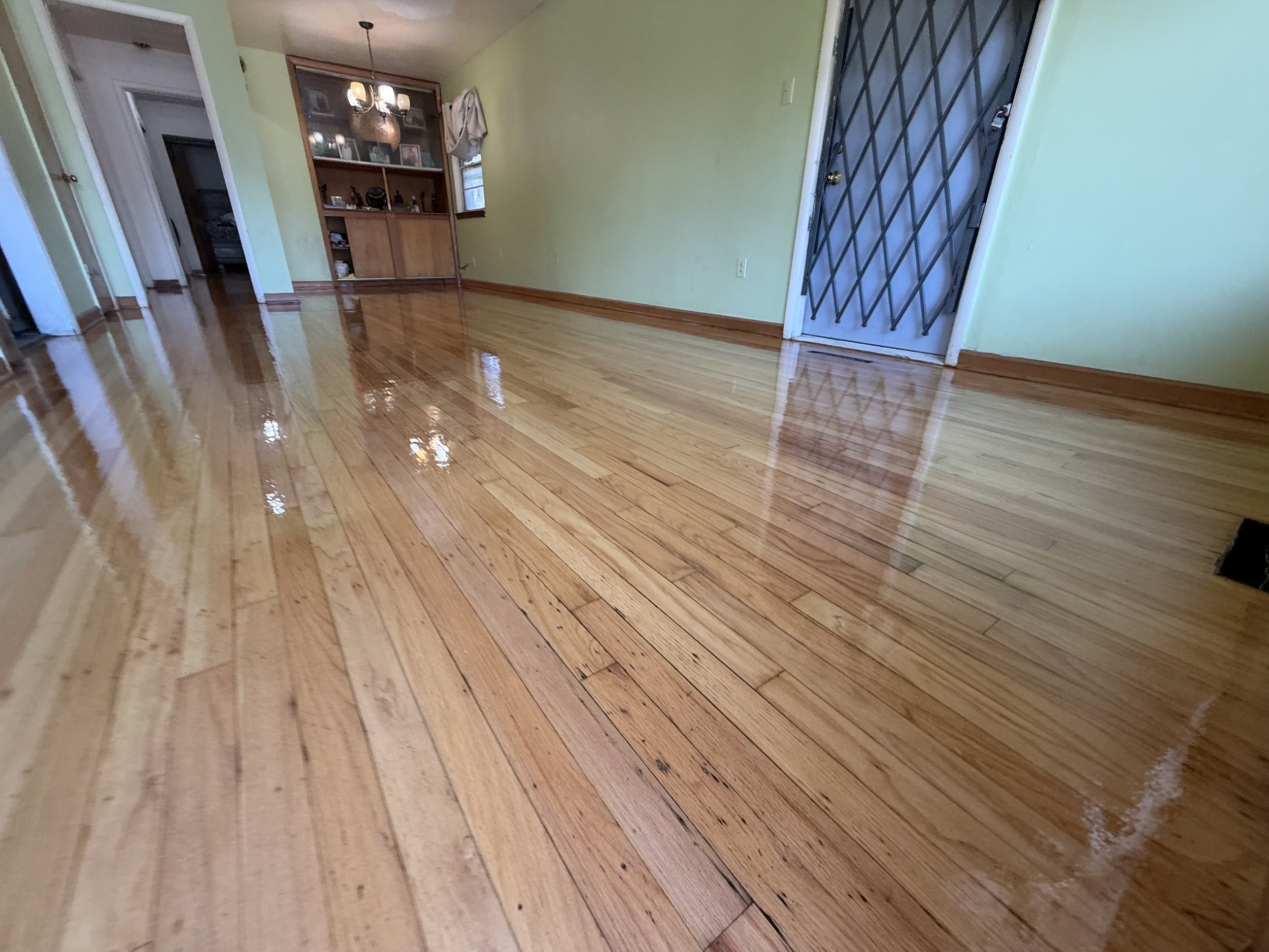 Refinished hardwood flooring with a renewed natural tone and durable protective finish