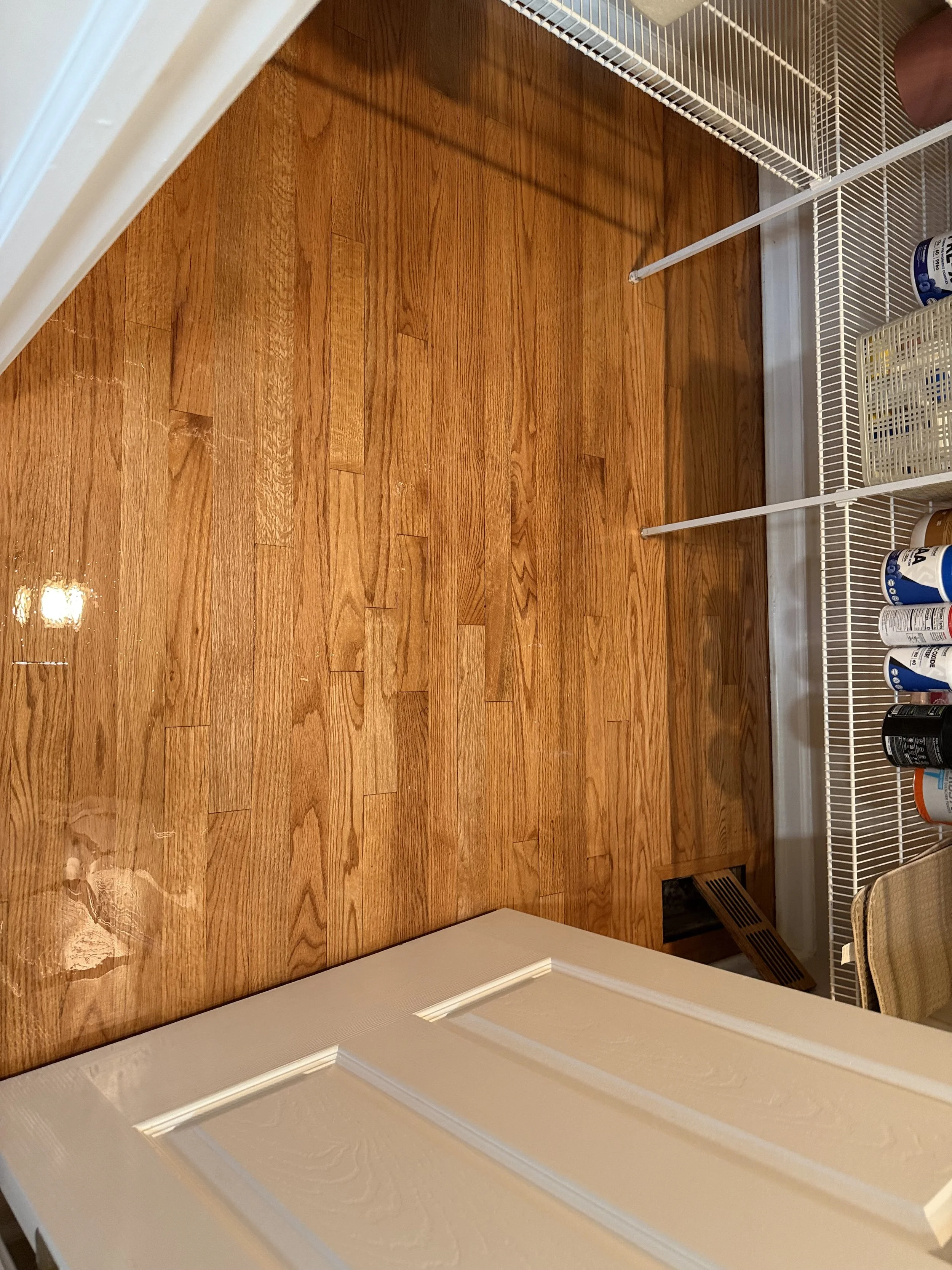 Refinished hardwood flooring with an even natural stain and protective finish