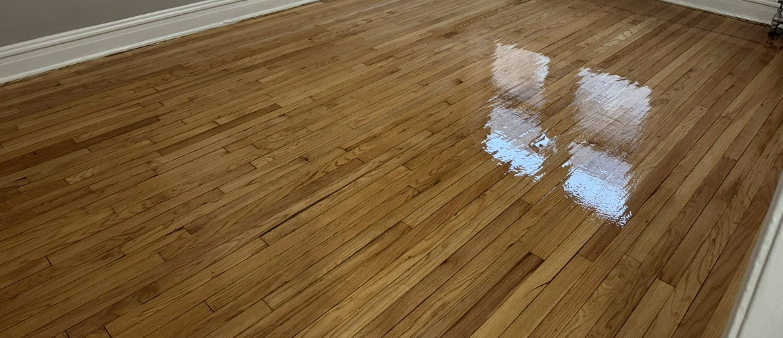 ALTERNATE FILENAME: hardwood-floor-refinishing-belvidere-il.jpg  IMAGE ALT TEXT: Professionally refinished hardwood floors in Belvidere, IL by Cristian Maxin Flooring