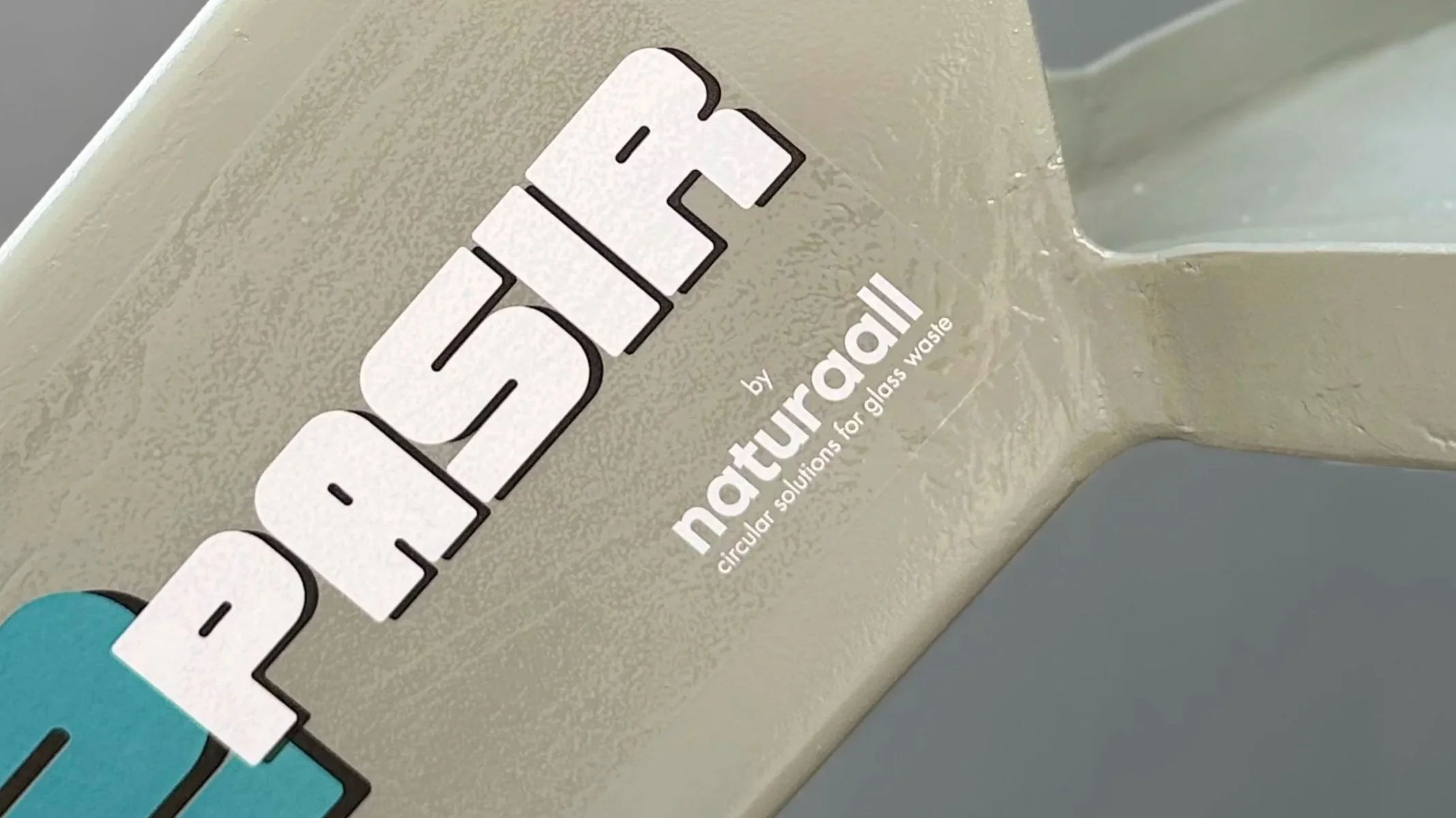 Close-up image of a cleaning product label with the brand name 'Carenature' and the description 'by circular solutions for glass waste'.